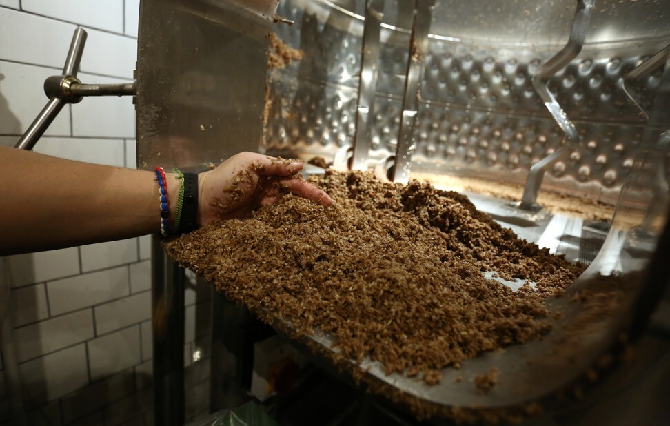 Yeung collects discarded grains at Little Creatures Brewing. Photo: Jonathan Wong