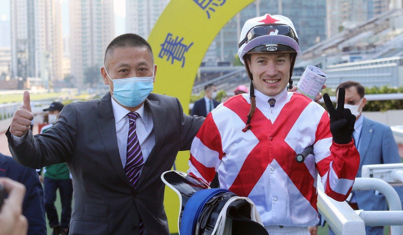 Trainer Danny Shum (left) and jockey Antoine Hamelin celebrate Baltic Success’ win.