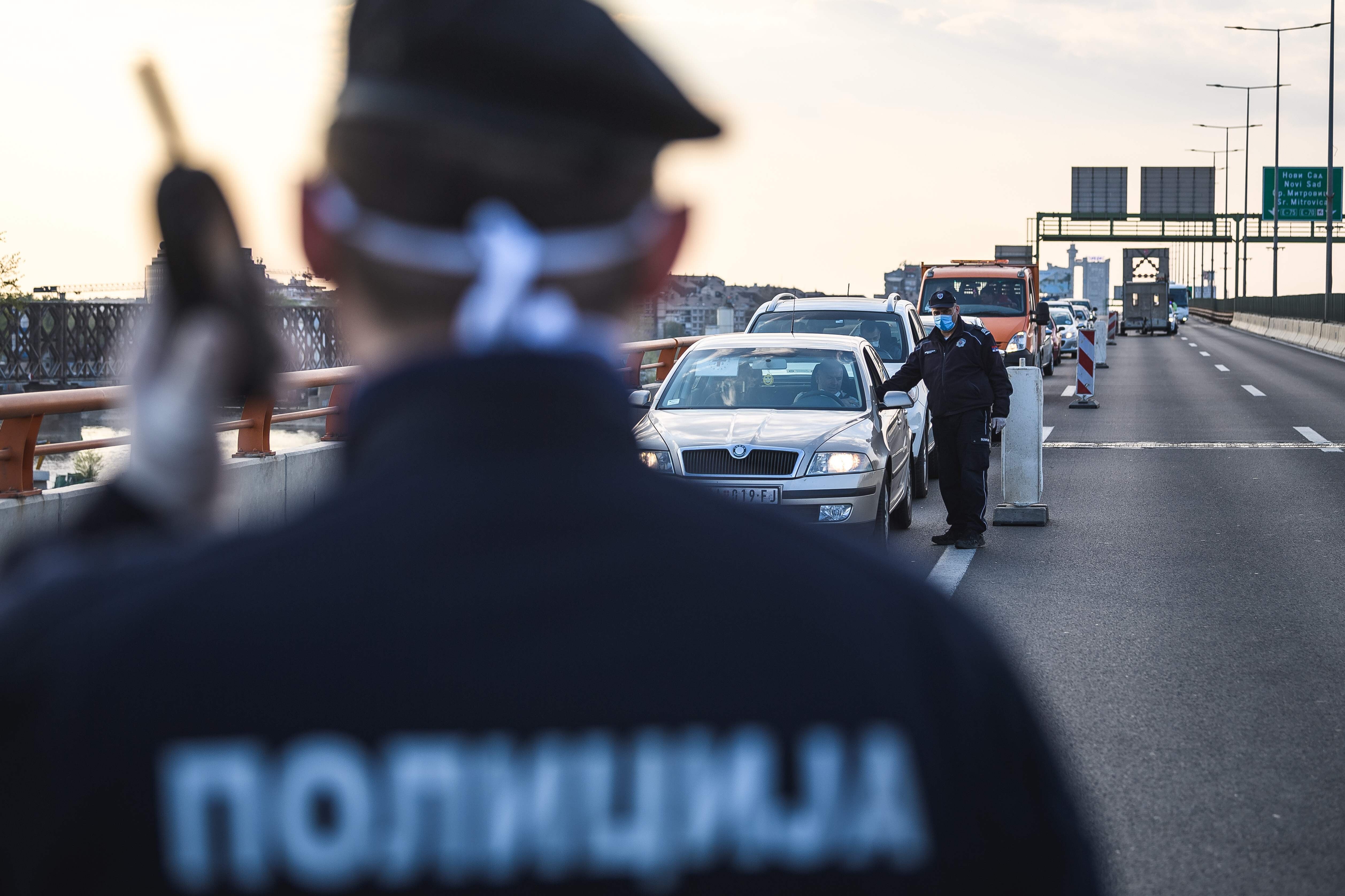 Police officers stop drivers in Belgrade this month after the introduction of a nighttime curfew in a bid to curb the spread of coronavirus. Photo: AFP