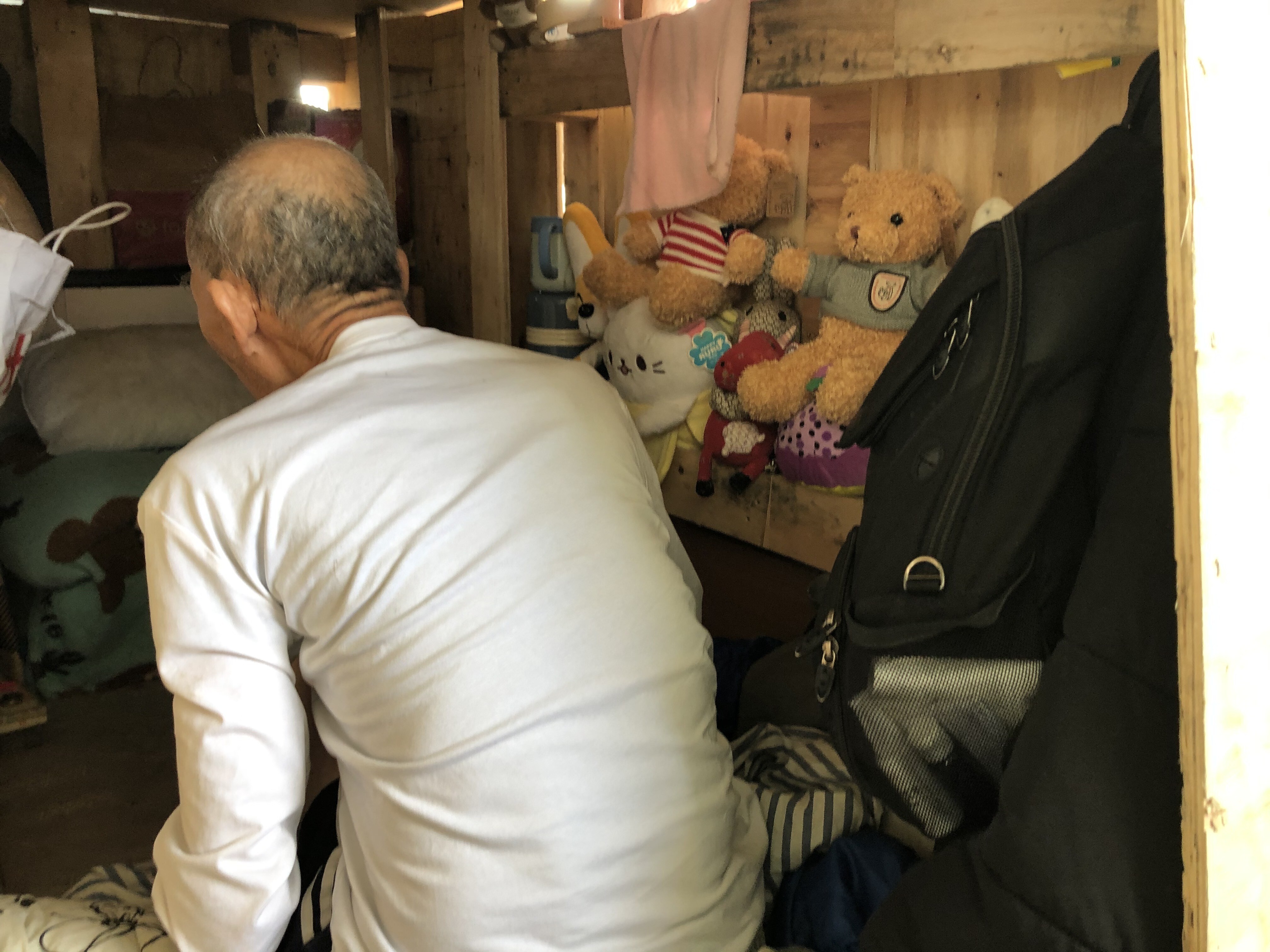Lau who lives next to his friend of 40 years, Lee, has put stuffed toys in his home to make it more comfortable. Photo: Laura Westbrook