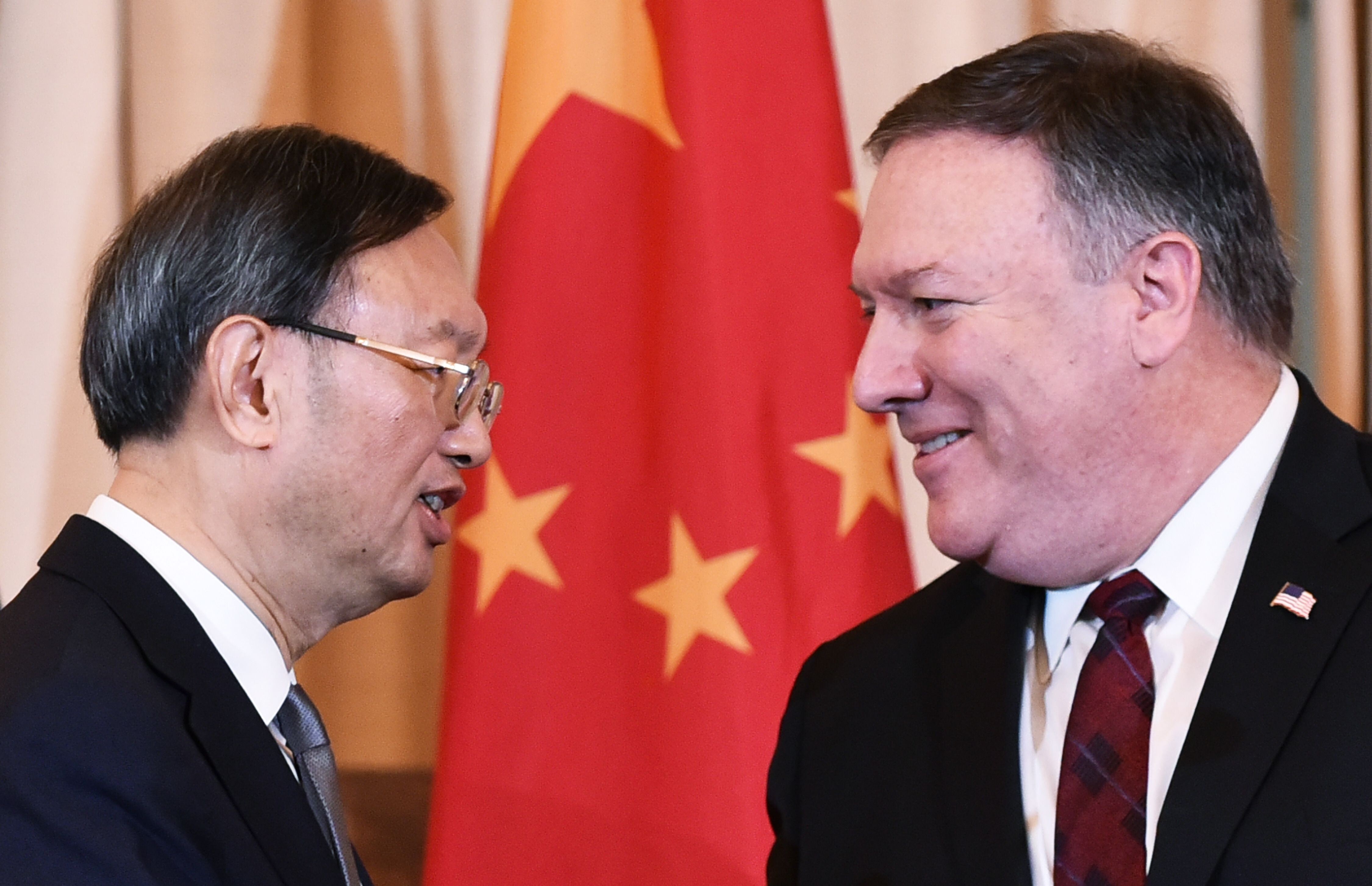 Yang Jiechi and US Secretary of State Mike Pompeo shake hands following a press conference at the US State Department in Washington in November 2018. Photo: AFP