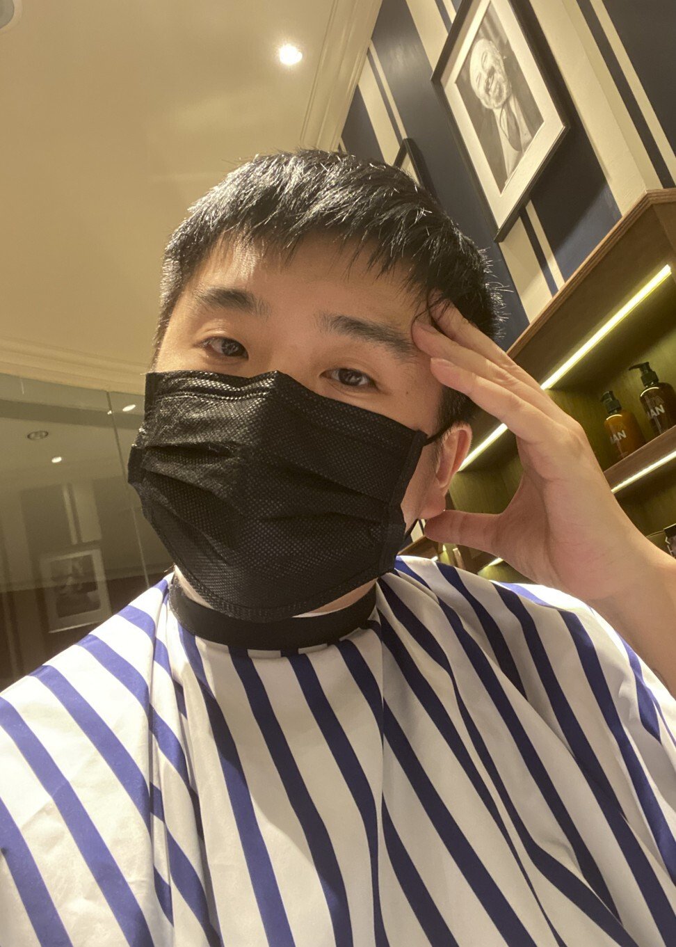 Chan got a celebratory haircut at a salon in the Kerry Hotel in Hong Kong on the day of his release from home quarantine. Photo: Declan Chan
