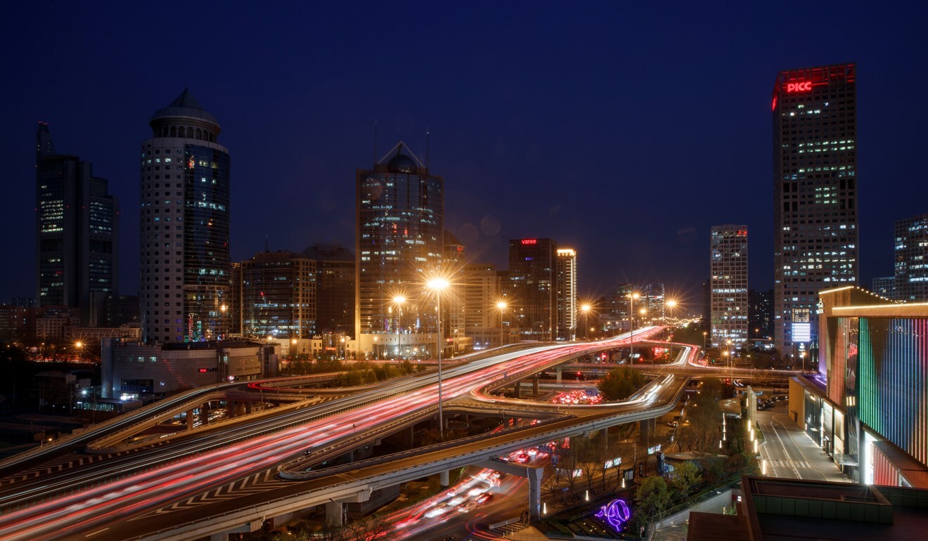 Cars jam a major thoroughfare at evening rush hour in the Central Business District in Beijing, China, April 7, 2020. Picture taken with a slow shutter speed. REUTERS/Thomas Peter