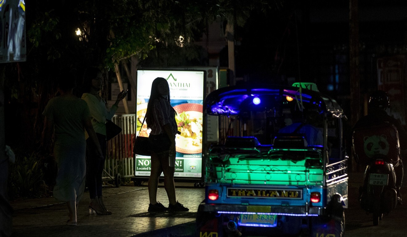 Sex workers in a red-light area of Bangkok, Thailand. Photo: AP