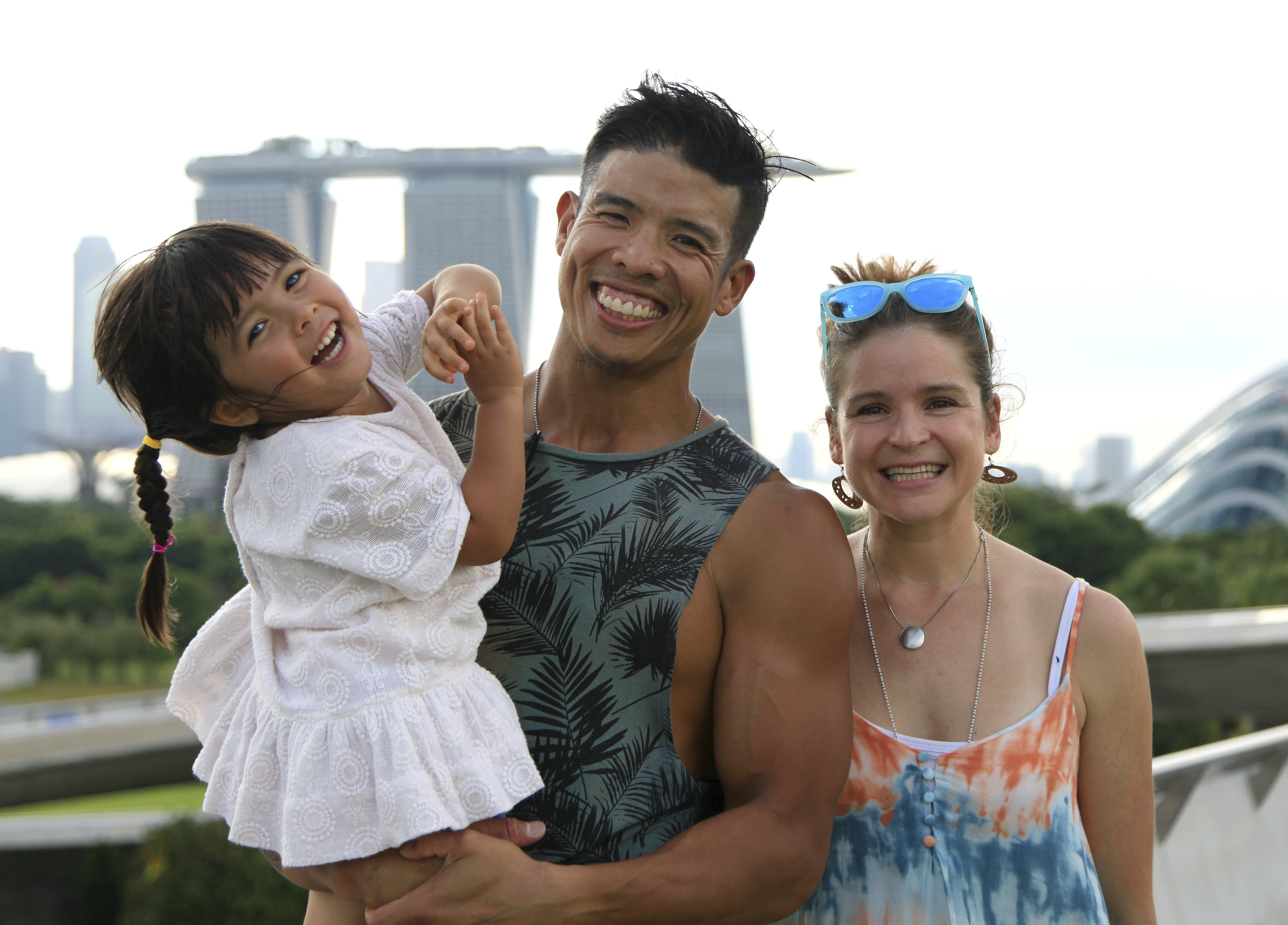 Handout image received on April 16, 2020 shows The Tan Family, Luke, 41, and Emilie, 36, and Sienna. Singaporean power couple Luke Tan and his wife, Canadian Emilie Tan, are plant-based role models in the era of The Game Changers and the coronavirus pandemic. Luke is a body-building strength athlete, âvegucatorâ and coach, and Emilie is an ultra-marathon runner. The couple is vegan and both are advocates for this lifestyle, speaking at popular events. They are also raising a plant-based toddler. [19APRIL2020 FEATURES HEALTH] CREDIT: Angel Jelita