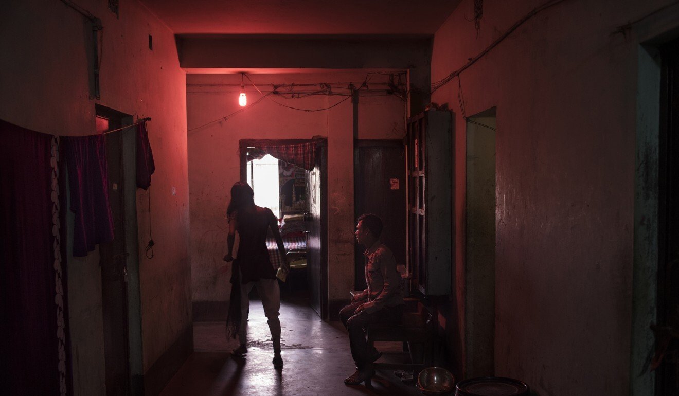 A sex worker with a client in Faridpur, Bangladesh. Photo: Miguel Candela