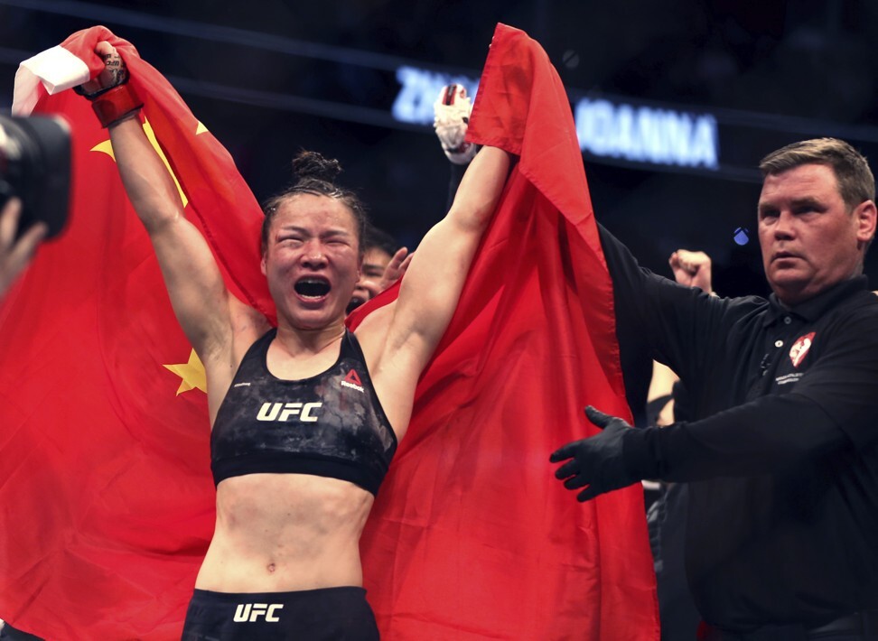 Zhang Weili celebrates her win by decision over Joanna Jedrzejczyk. Photo: AP