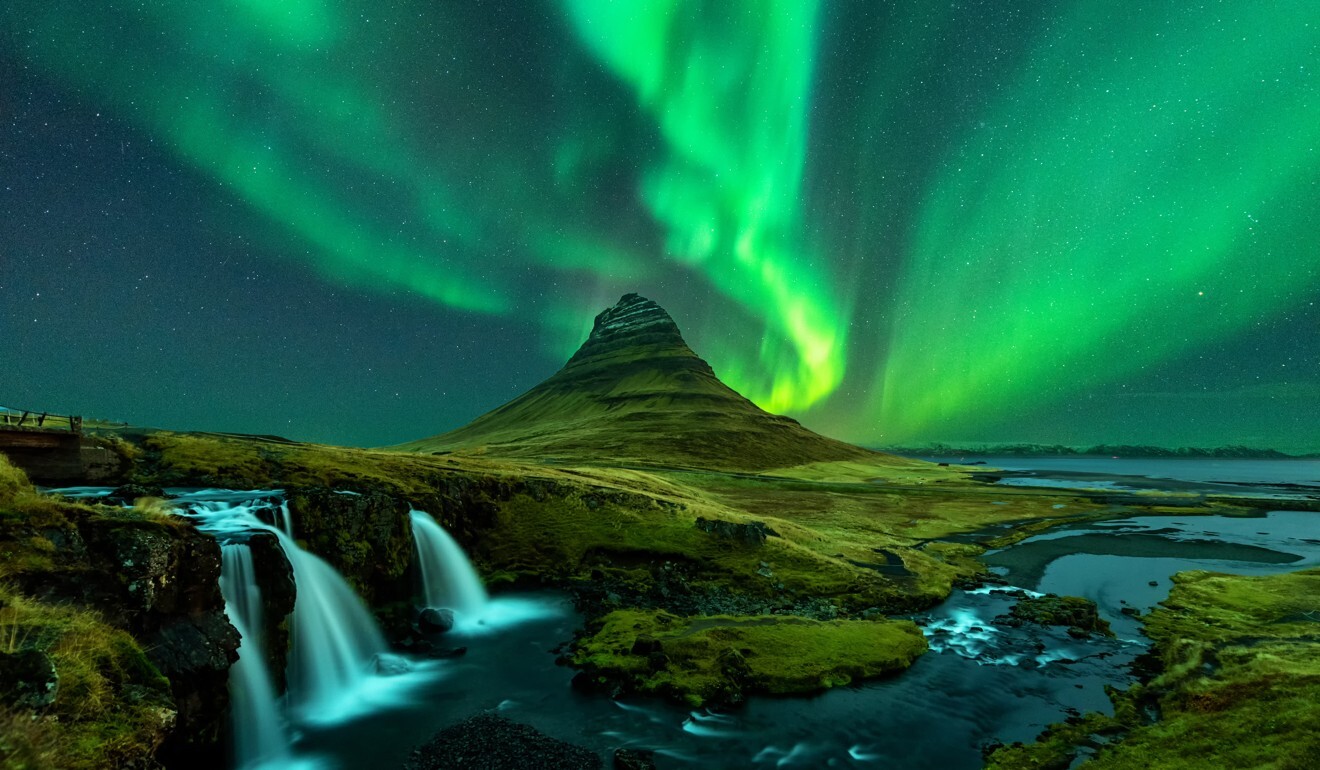 The northern lights over Kirkjufell mountain in Iceland. Photo: Getty Images