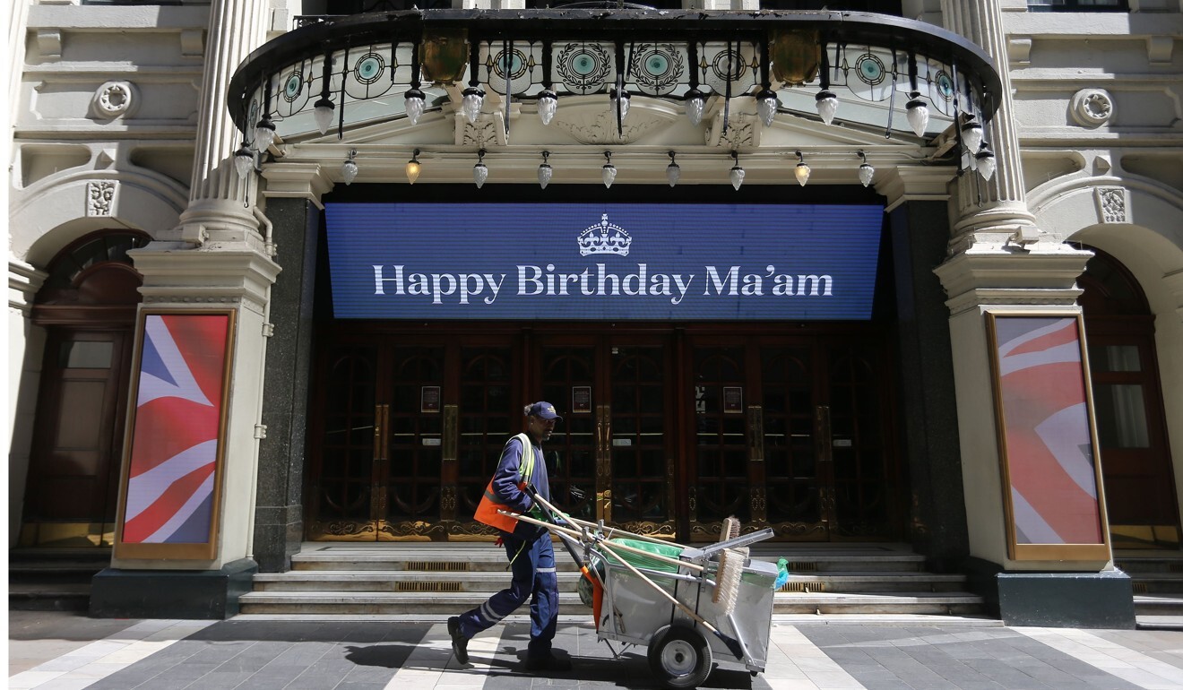 An electronic sign above the entrance to the London Palladium theatre relays a birthday wish for Queen Elizabeth. Photo: AFP