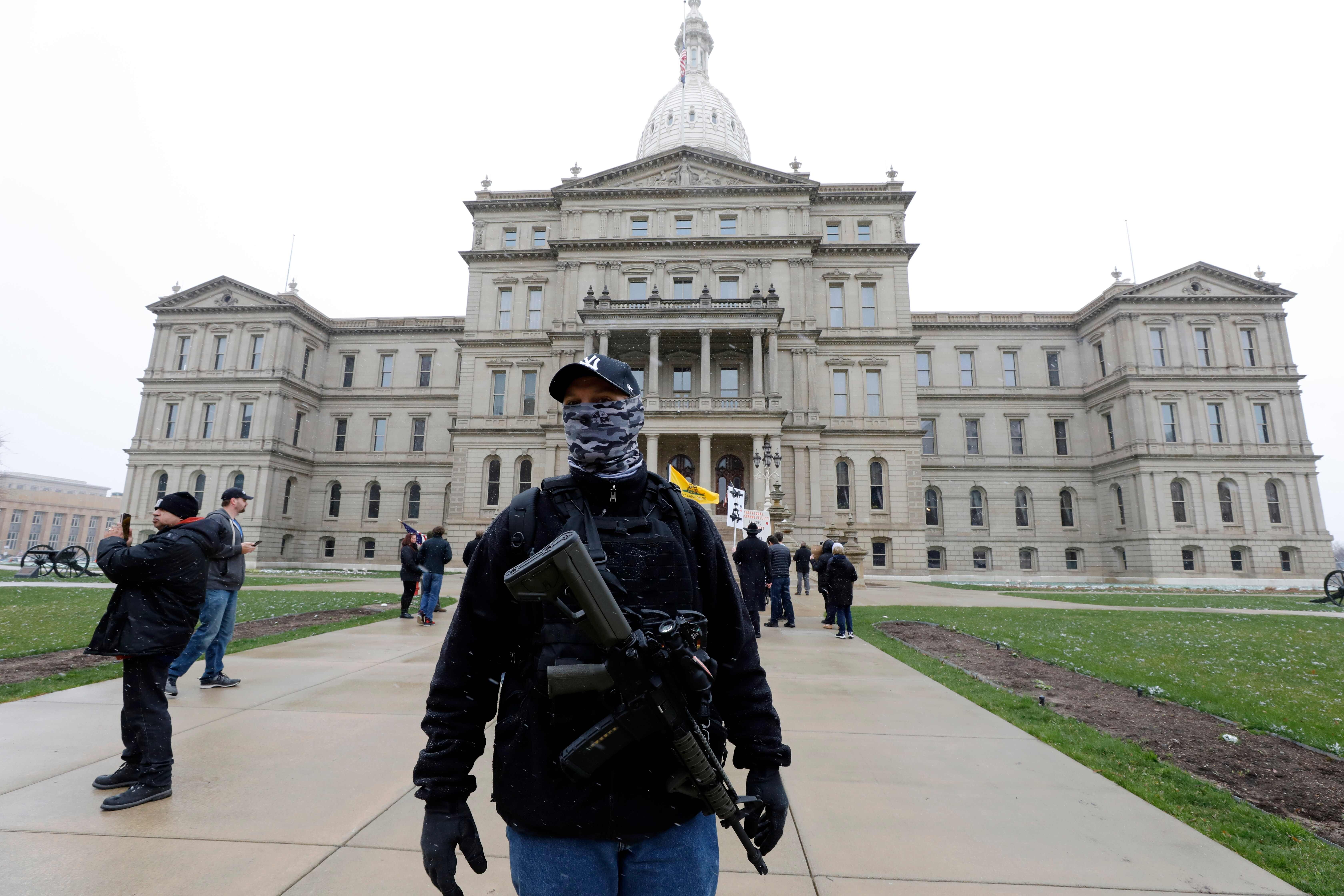 People protest against “excessive quarantine” at the Michigan State Capitol on April 15. Photo: AFP