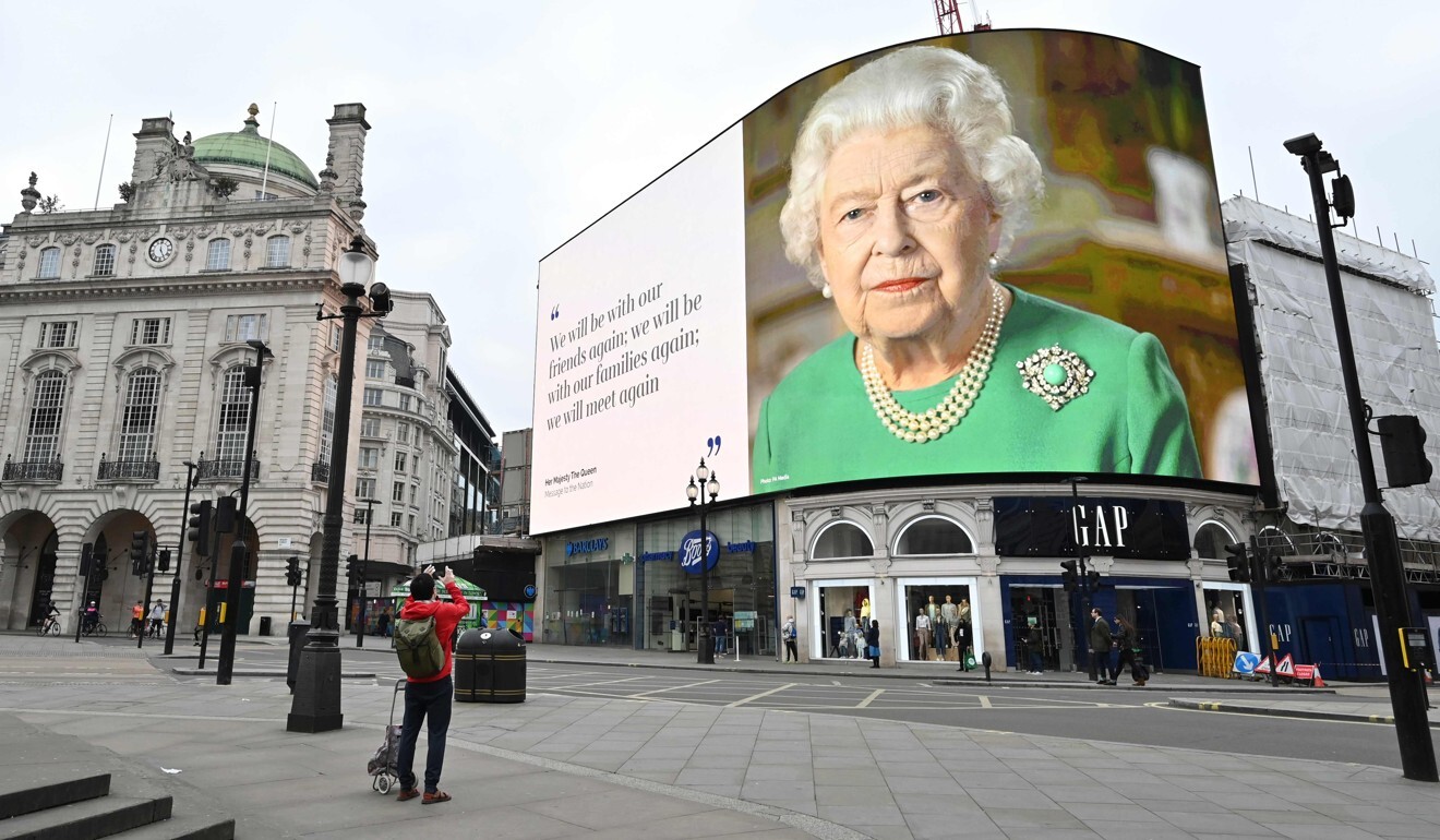 A still image of Britain's Queen Elizabeth with a message of hope from her special address to the nation is seen on the giant hoarding in Piccadilly Square, central London. Photo: AFP