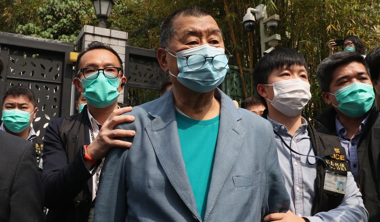 Apple Daily founder Jimmy Lai (centre) was arrested at his home in Ho Man Tin on Saturday. Photo: Edmond So