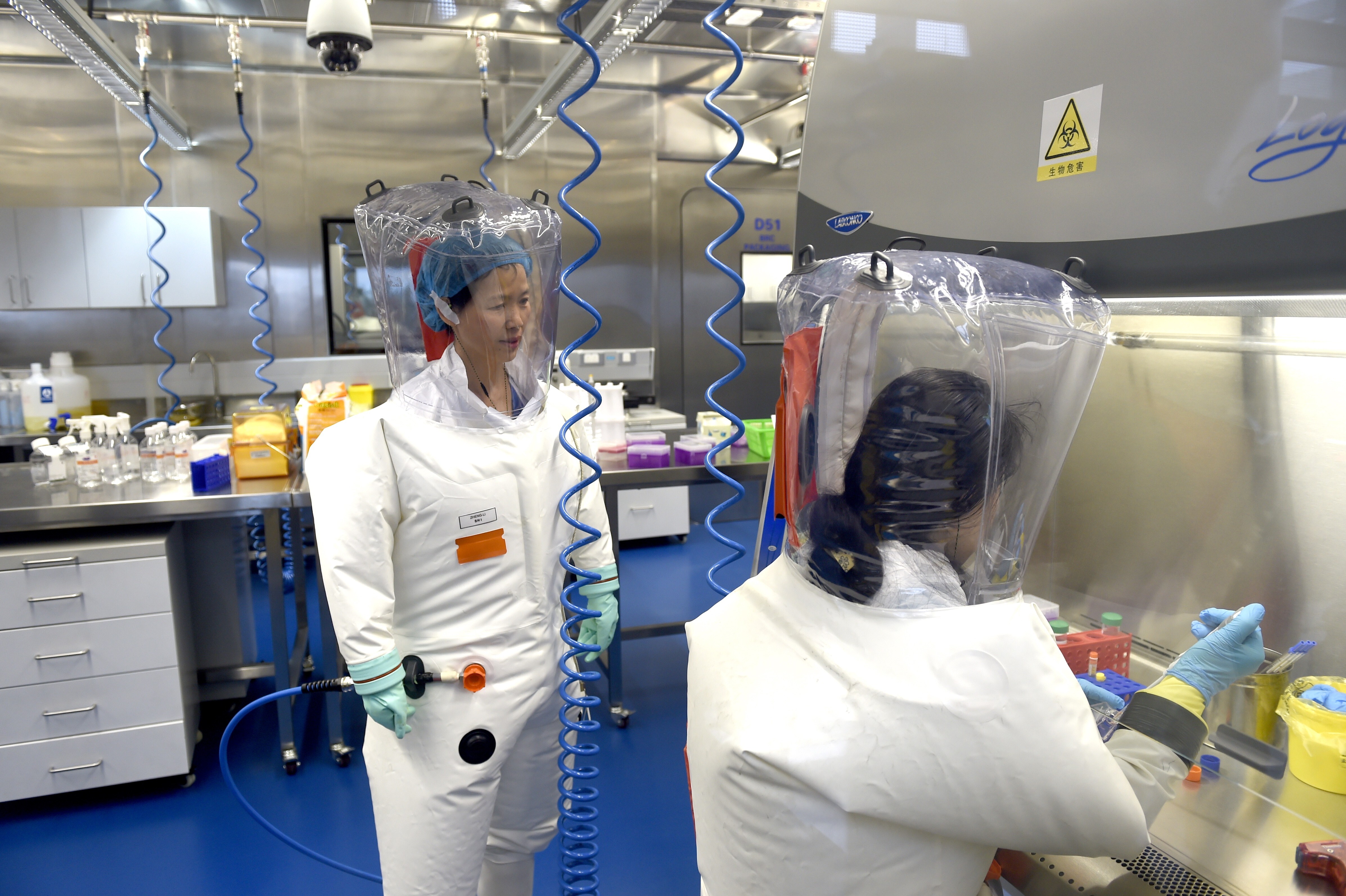 Researchers in a lab at the Wuhan Institute of Virology, which is at the centre of a persistent conspiracy theory about the origin of the new coronavirus. Photo: EPA-EFE