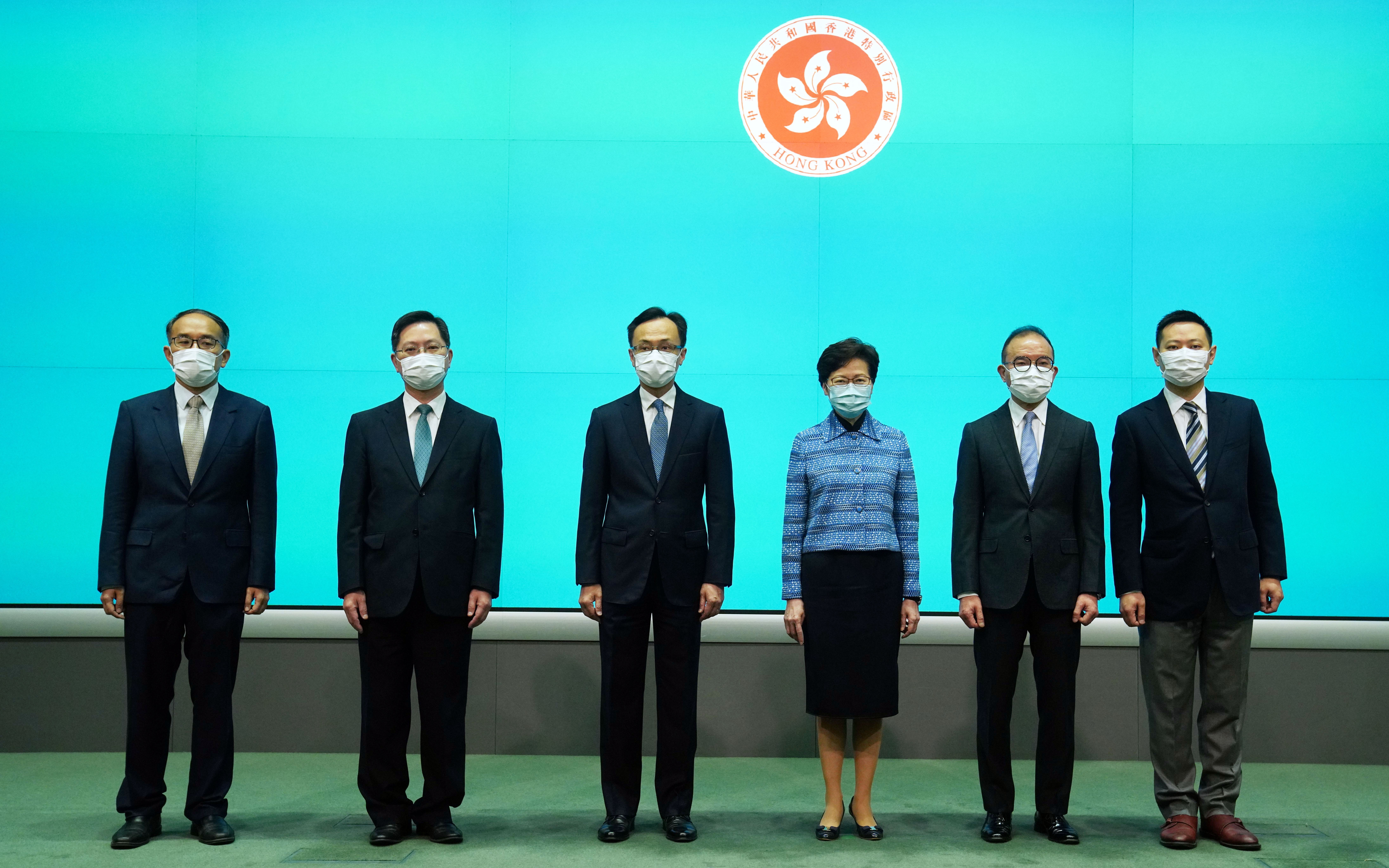 Carrie Lam with her newly appointed secretaries: (from left) Christopher Hui, Alfred Sit, Patrick Nip, Erick Tsang and Caspar Tsui. Photo: Sam Tsang