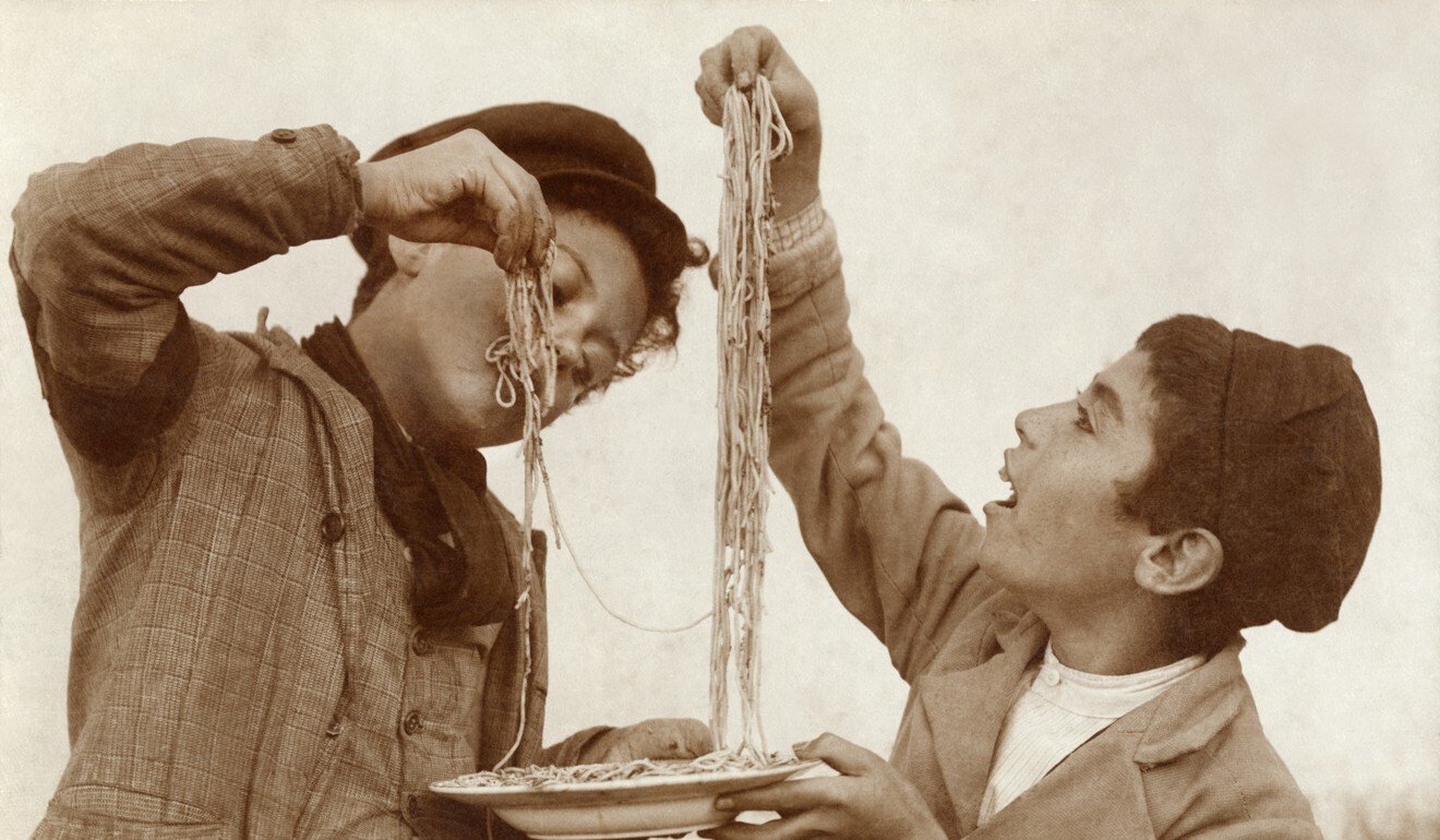 Young boys eat spaghetti with their hands in this undated photo. Photo: Shutterstock