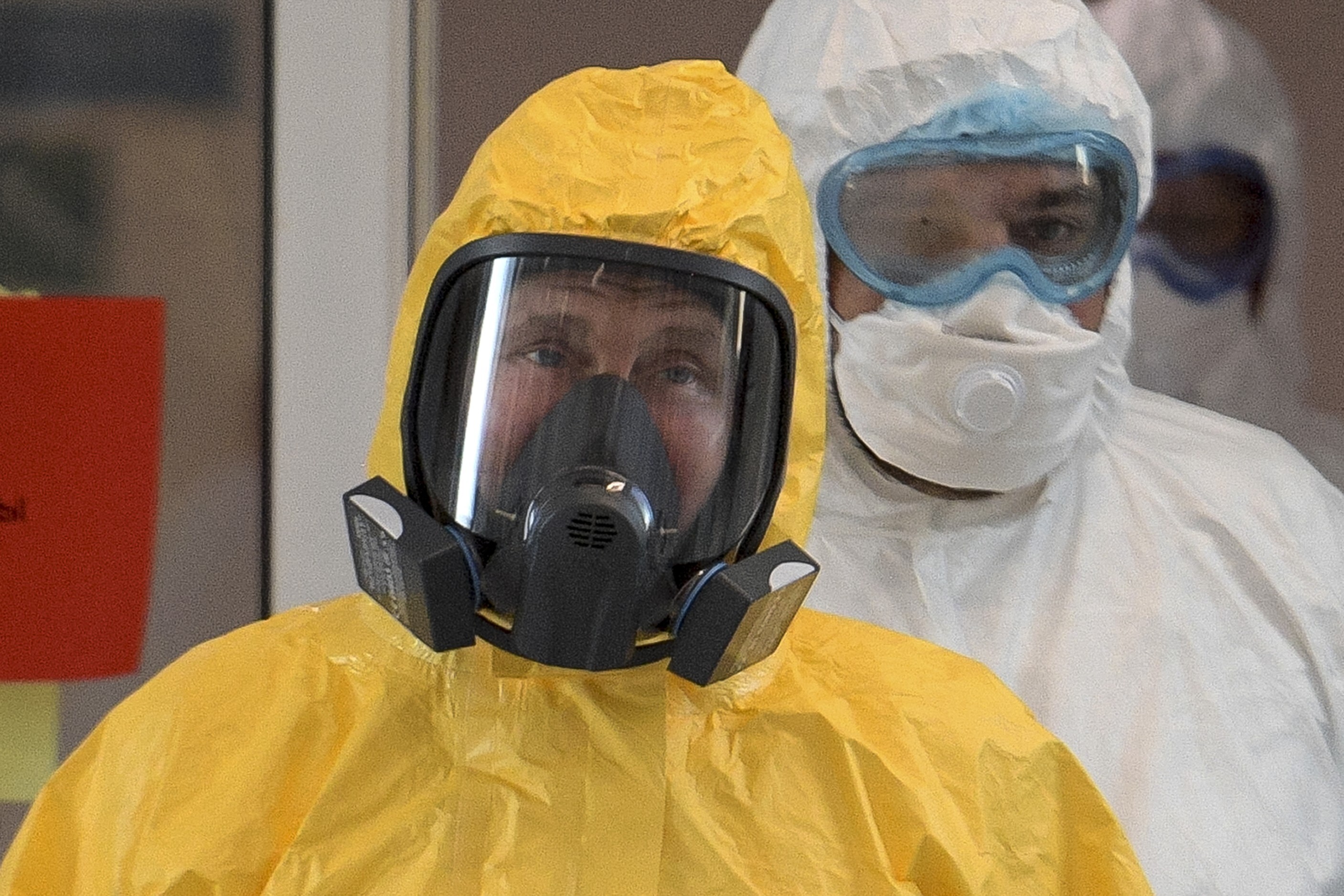 Russian President Vladimir Putin, wearing a protective suit, visits a hospital for coronavirus patients in Kommunarka, outside Moscow. Photo: AP