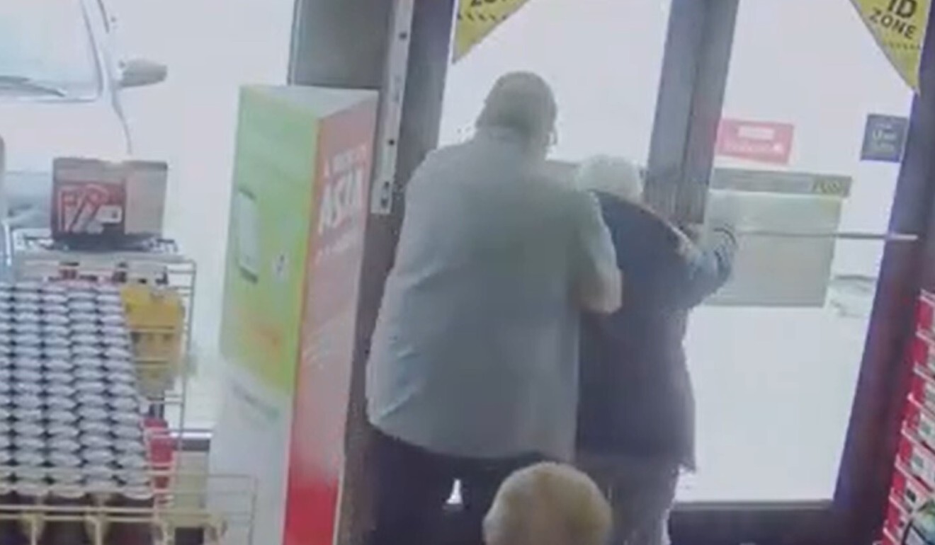 The suspect in a racist attack on an elderly Asian man throws his victim out of a Vancouver convenience store on March 13, in a video released on Wednesday by Vancouver police. Photo: Handout