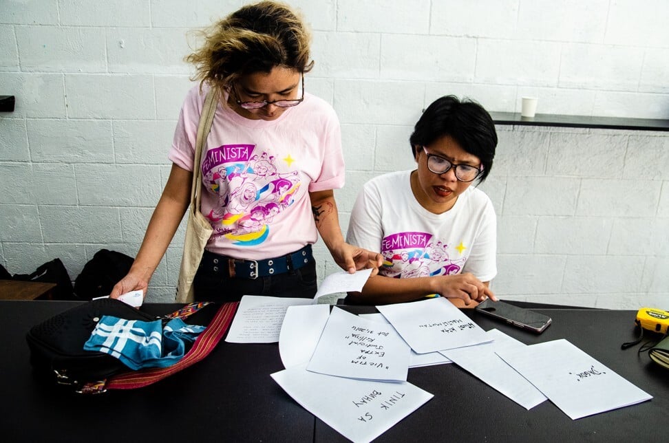 Two of the all-female staff at Gantala Press sift through material. Photo: Maro Enriquez