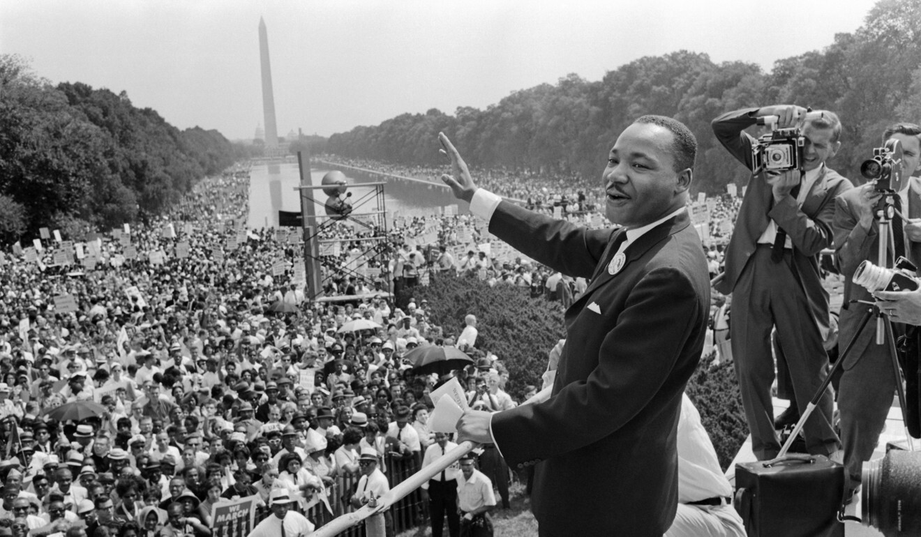 The civil rights leader Martin Luther King waves to supporters on August 28, 1963, on the Mall in Washington during the March on Washington. During his incarceration in Birmingham Jail, King wrote a letter which became an influential text of the civil rights movement. Photo: AFP