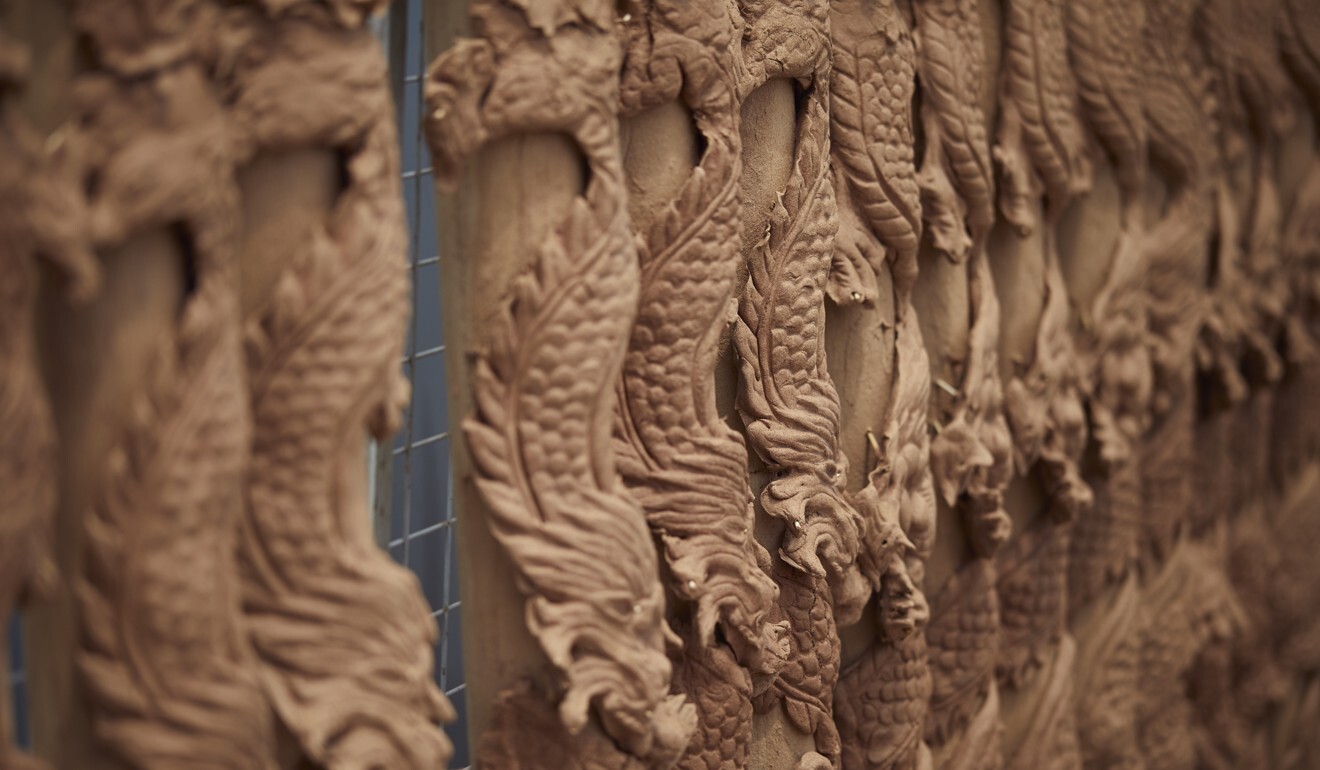 Tay’s hand-carved dragons decorate 2-metre-tall joss sticks. Photo: Tay Guan Heng