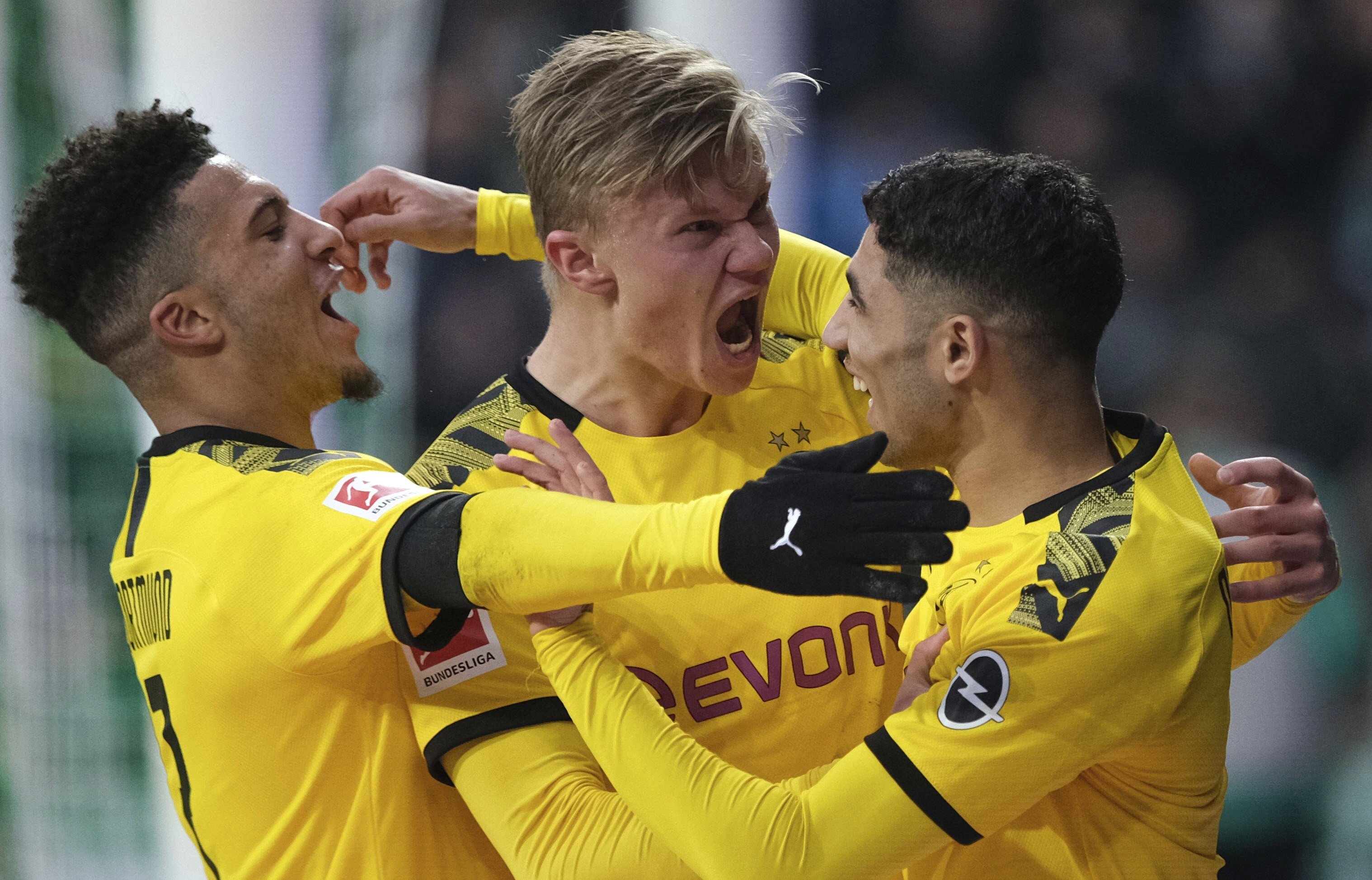 Borussia Dortmund players celebrate scoring a goal against Werder Bremen in the German Bundesliga. The league is set to resume on May 9. Photo: AP