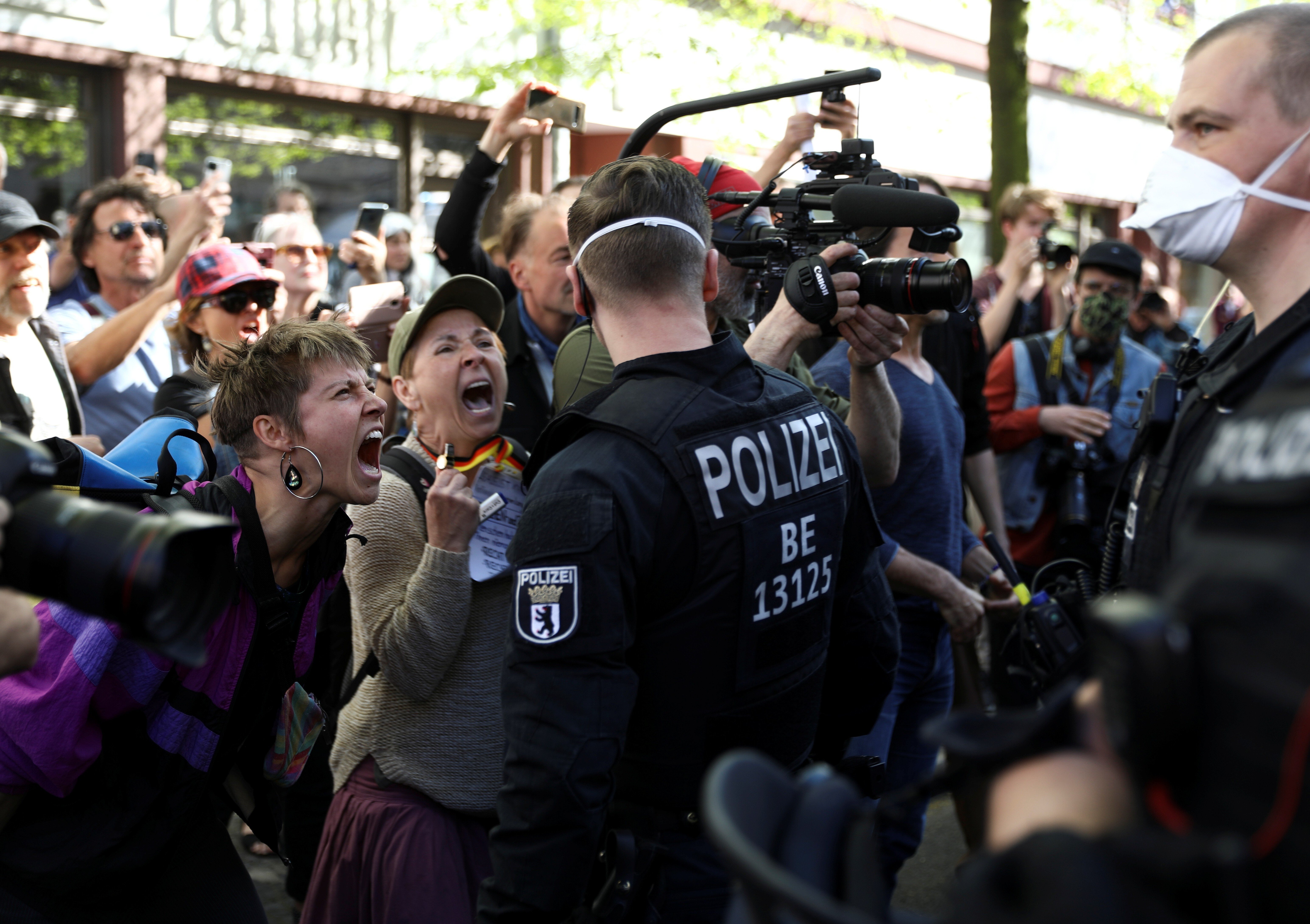 People shout at police during a demonstration in Berlin, Germany, on April 18. Photo: Reuters