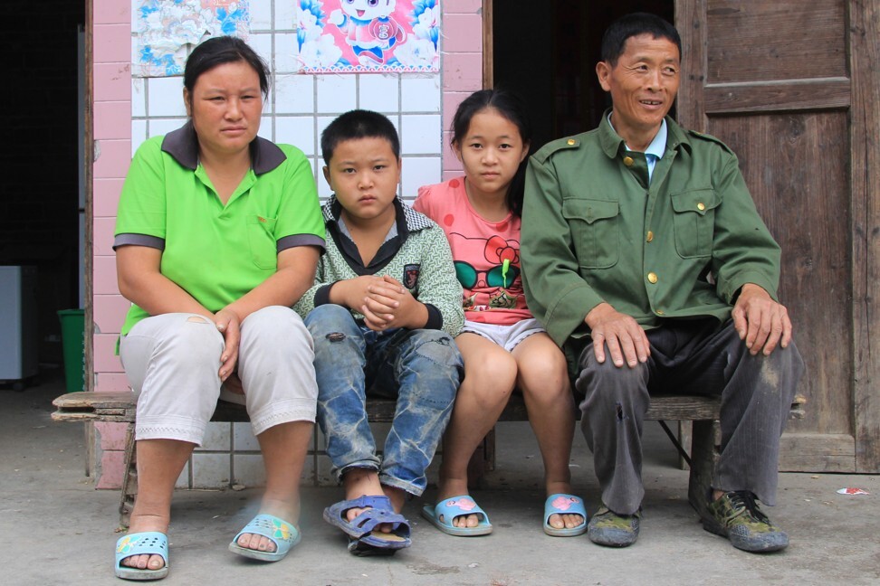 Zhao (right) and his family. The iron ore miner died of the fatal lung disease pneumoconiosis in 2018.