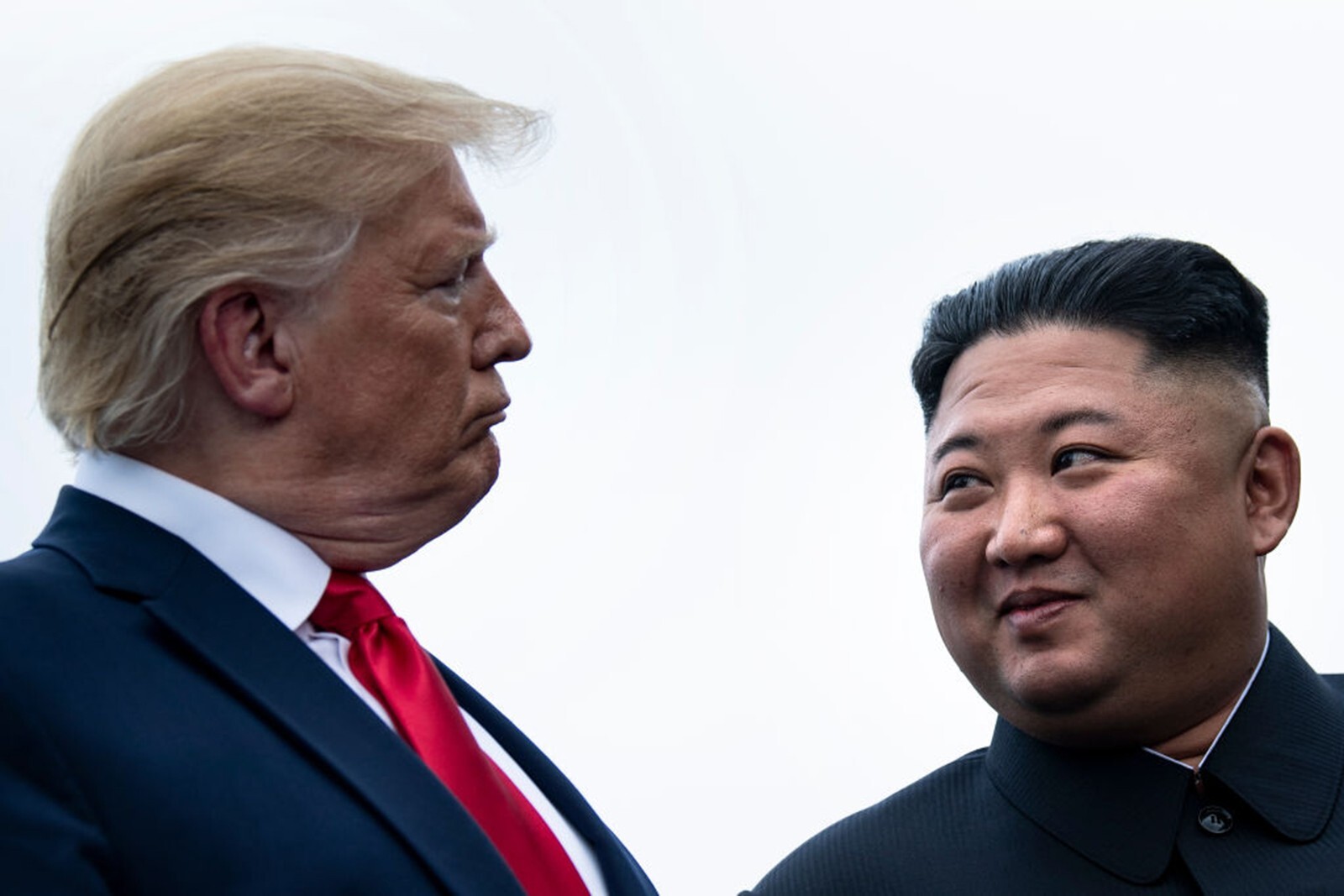 US President Donald Trump and North Korea's leader Kim Jong-un talk before a meeting in the demilitarised zone in June 2019. Photo: TNS