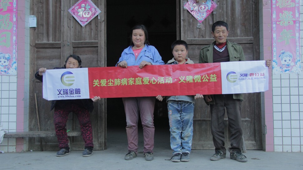Zhao (right) and his family before his death in 2018.