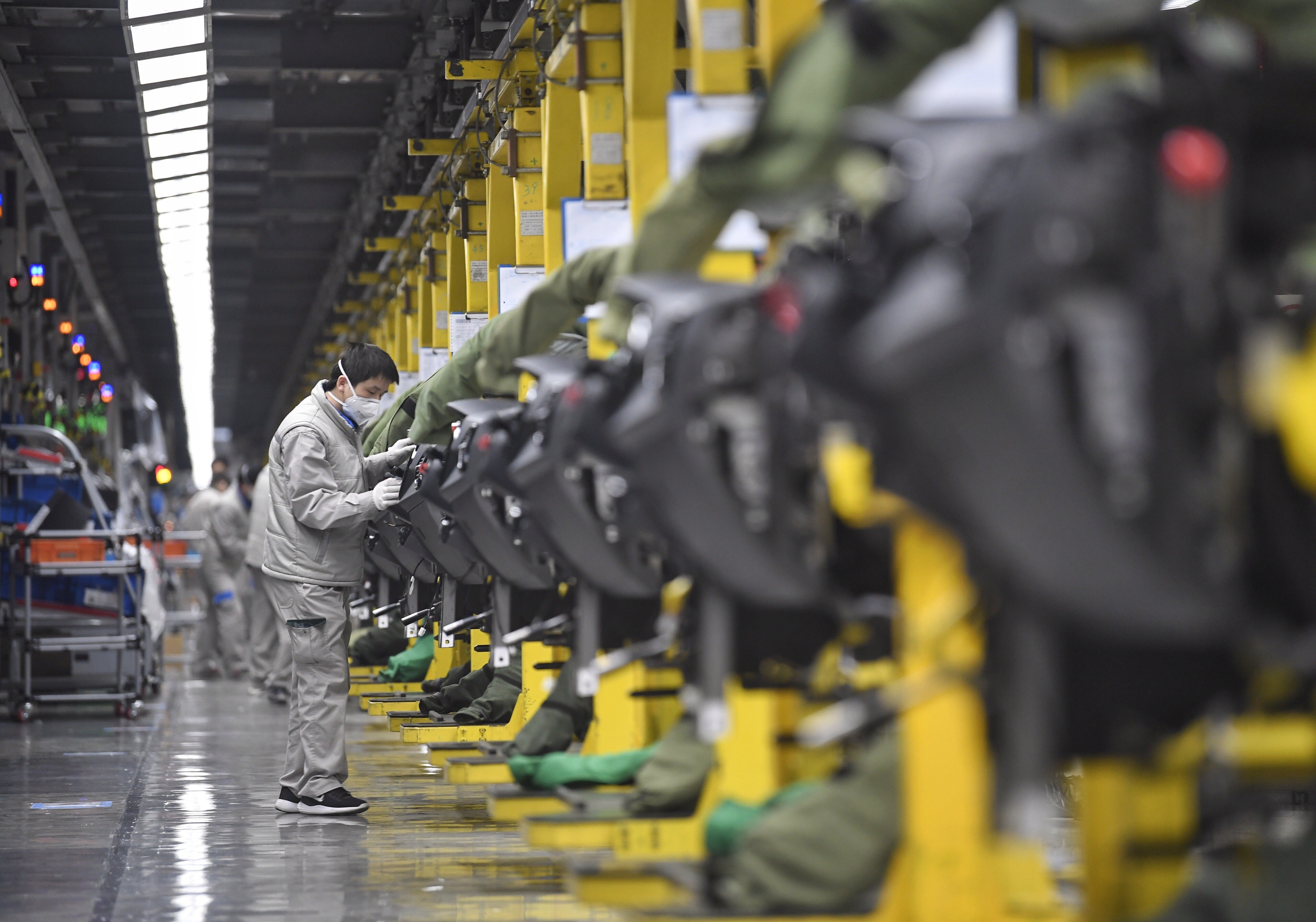 Employees work on the assembly plant of FAW-Volkswagen Automobile in Chengdu, southwest China’s Sichuan province, on February 19, 2020. A survey in March of 237 companies found all reported that their supply chains had been affected by Covid-19. Photo: Xinhua