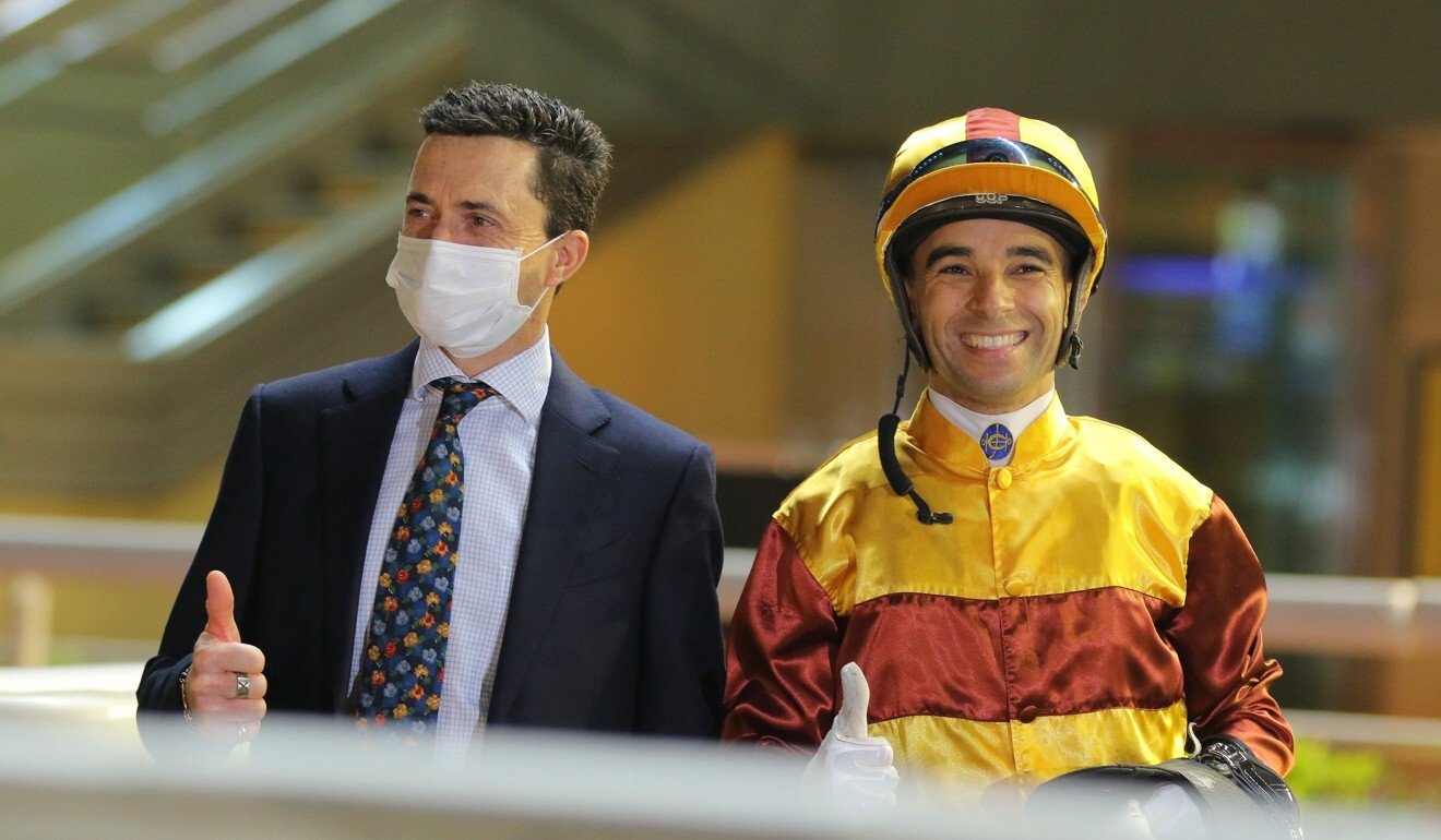 Trainer Douglas Whyte and jockey Joao Moreira celebrate Simply Fluke’s win.