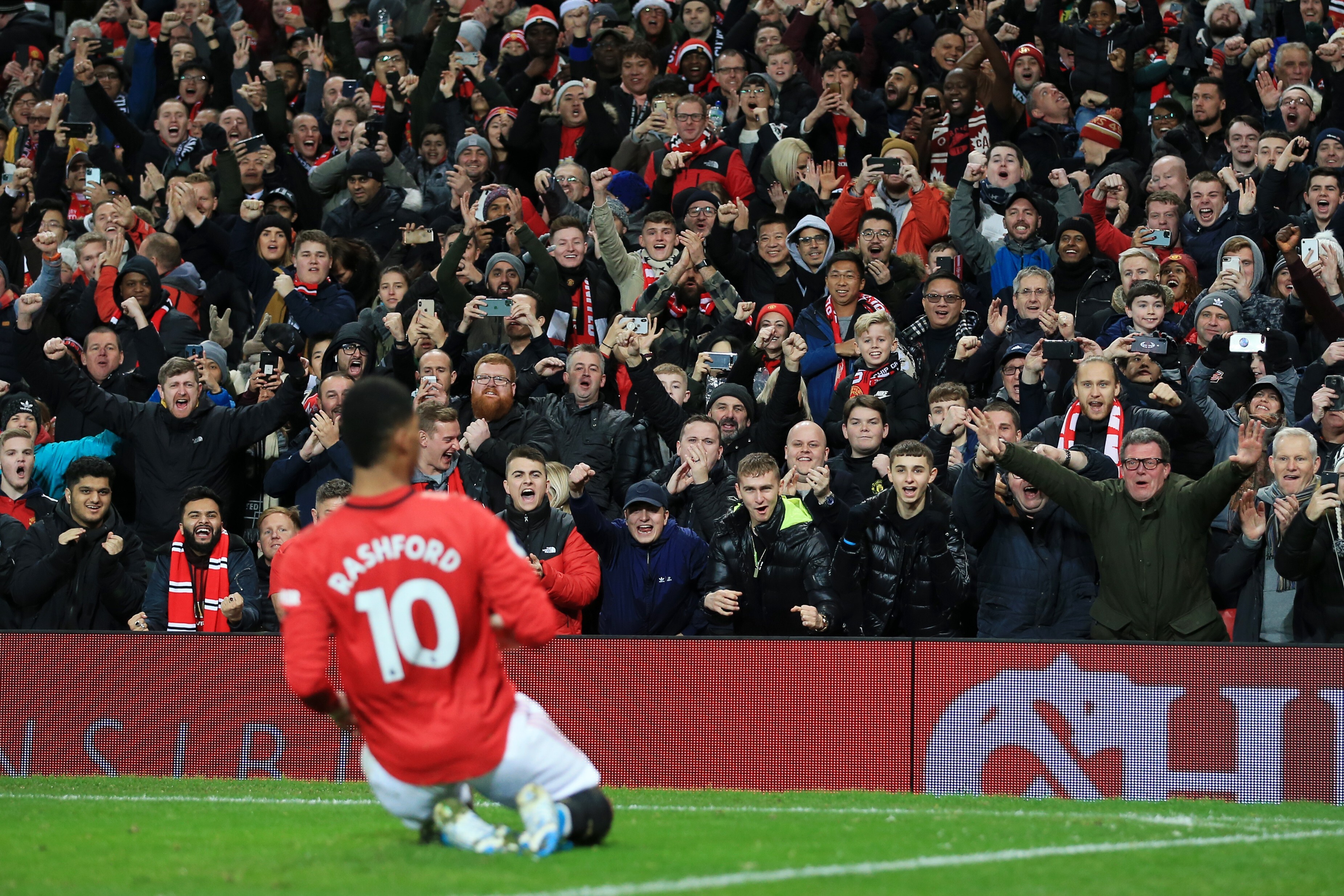 Fans cheer as Marcus Rashford celebrates scoring for Manchester United in the English Premier League match against Newcastle United at Old Trafford on December 26, 2019. Photo: Getty Images