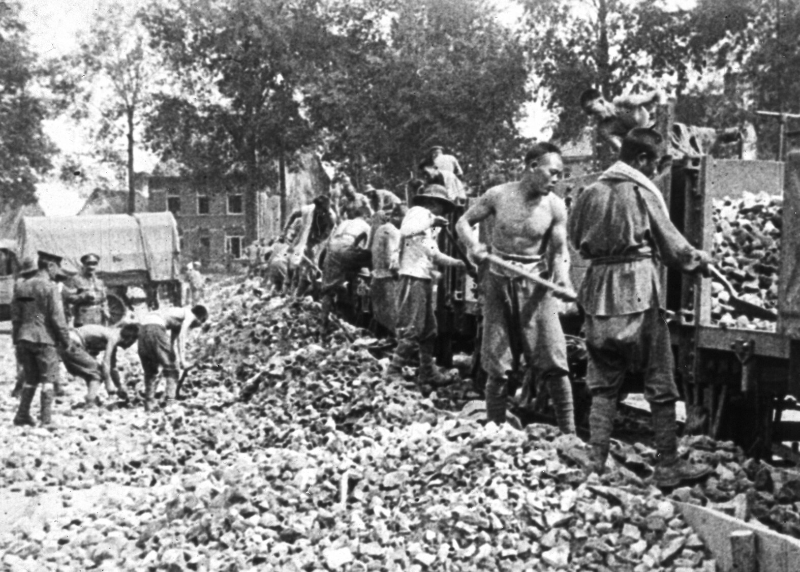 Men of the Chinese Labour Corps unload a train near the Western Front.