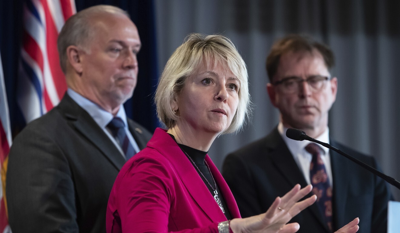 British Columbia provincial health officer Dr Bonnie Henry responds to questions while BC Premier John Horgan (left) and Health Minister Adrian Dix listen on March 6. Photo: AP