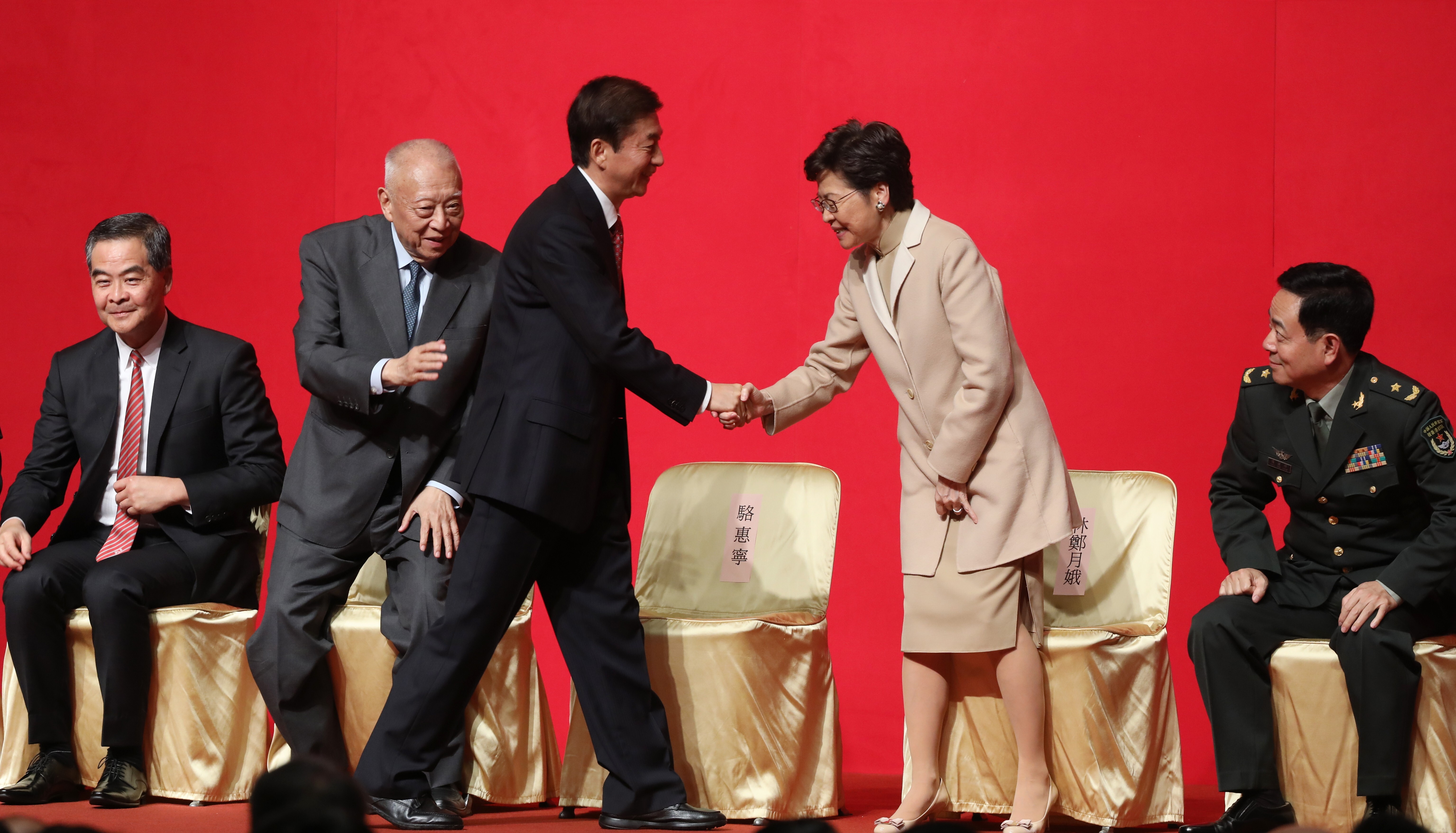 Luo Huining, director of Beijing’s liaison office, shakes hands with Chief Executive Carrie Lam, at the liaison office spring reception, at the Hong Kong Convention and Exhibition Centre on January 15. Photo: Sam Tsang