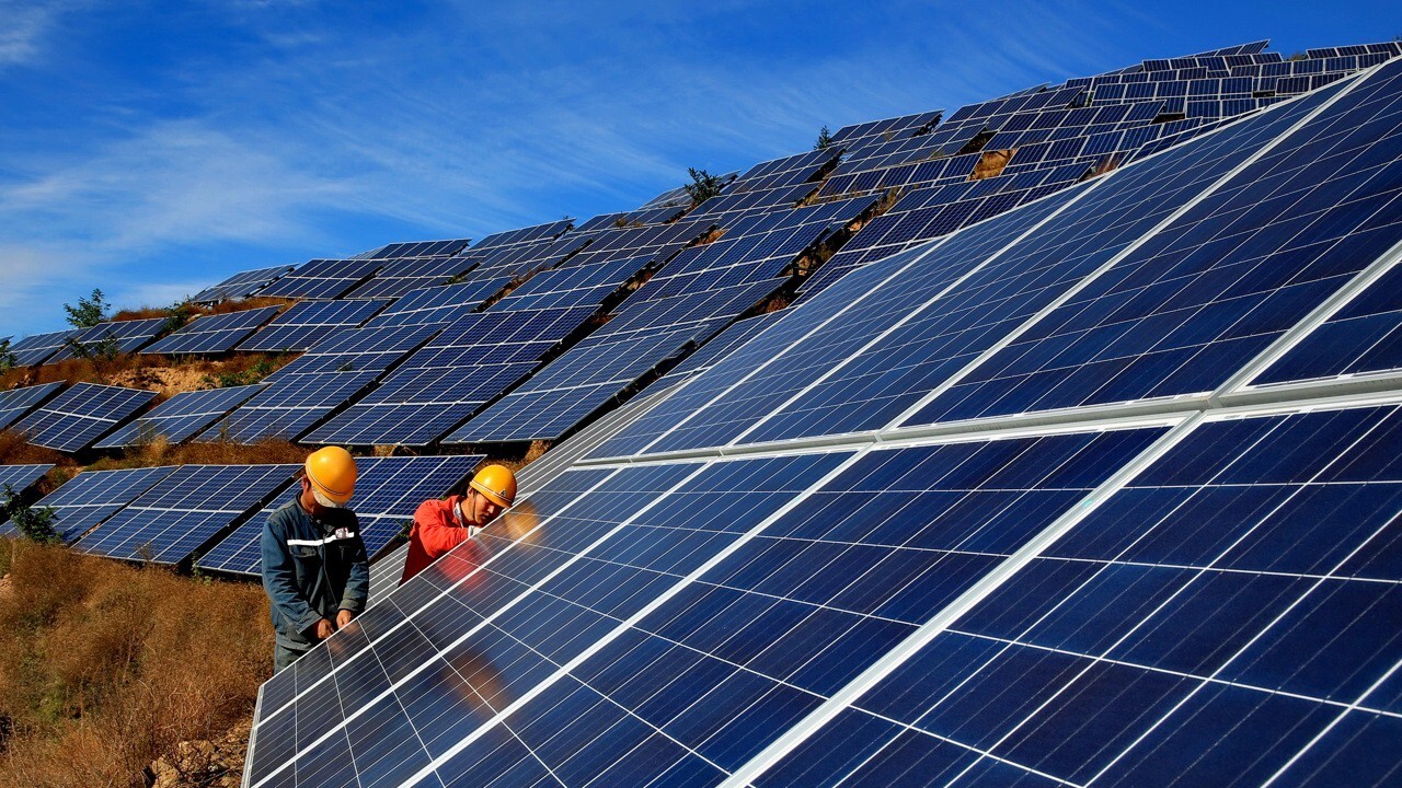 Workers construct a solar power field in Qinhuangdao located in northern Hebei province in China. Photo: Xinhua