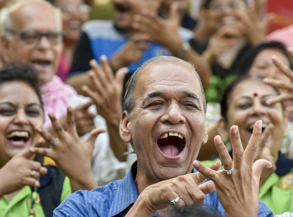 People participate in a laughter club in Mumbai, India. Photo: Hindustan Times via Getty Images