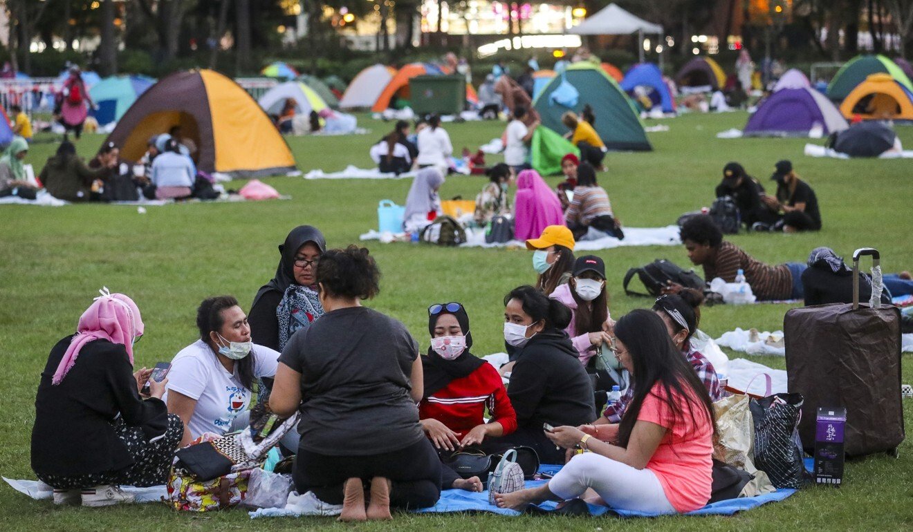 Foreign domestic helpers wearing face masks to guard against the coronavirus in Victoria Park. Photo: Dickson Lee