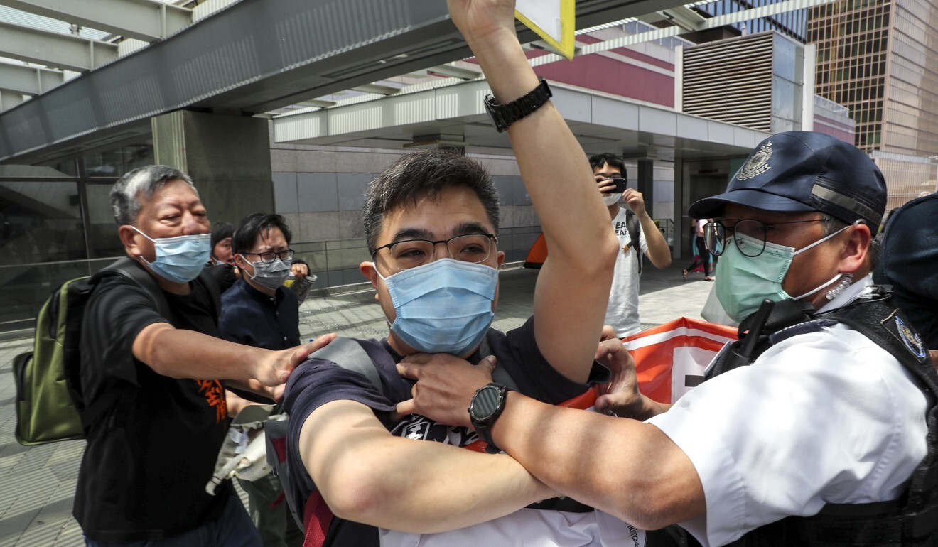 Labour Party vice-chairman Mak Tak-ching is arrested marching from Admiralty Centre to the government headquarters. Photo: Sam Tsang