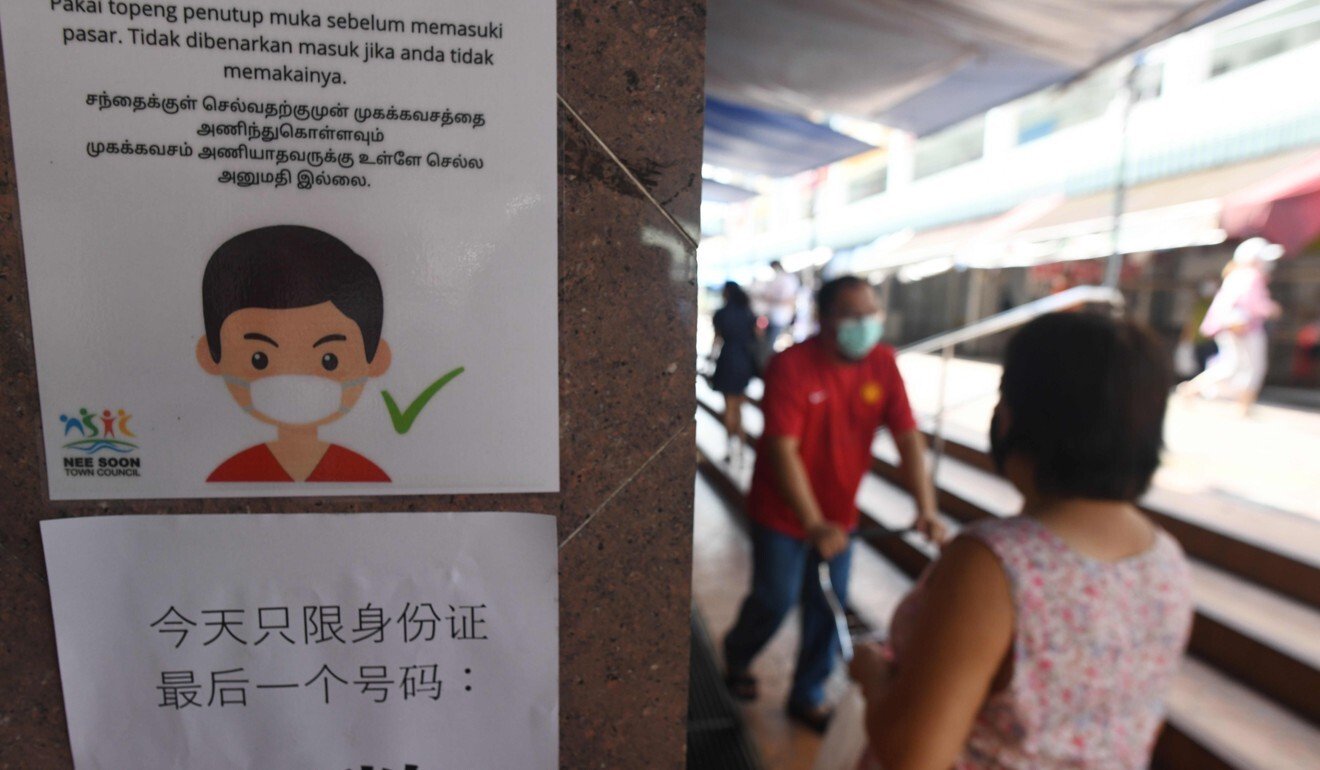 An information notice on prevention measures against the spread of the Covid-19 in Singapore. Photo: AFP