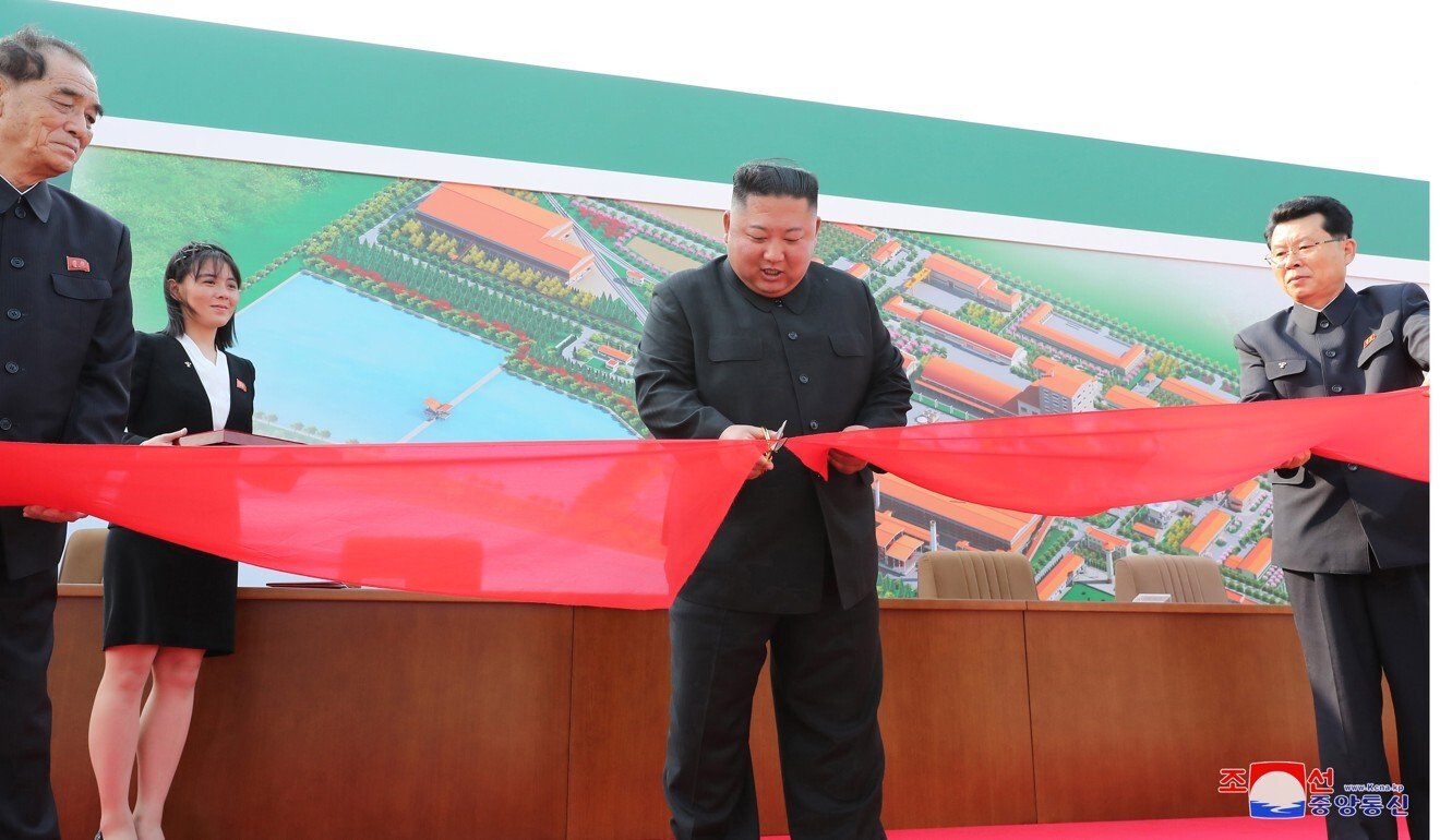 North Korean leader Kim Jong-un cuts a ribbon at a factory in Sunchon on May 1. Photo: EPA-EFE