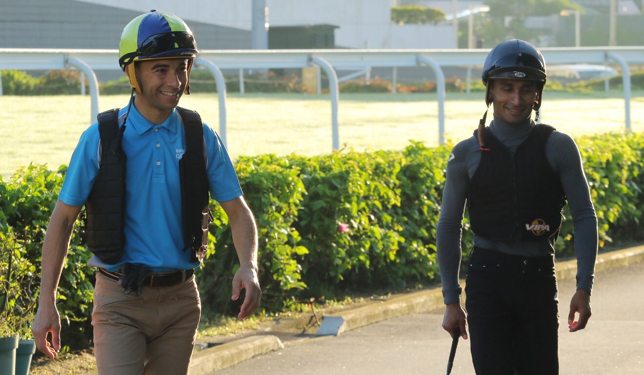 Joao Moreira and Karis Teetan at trackwork.