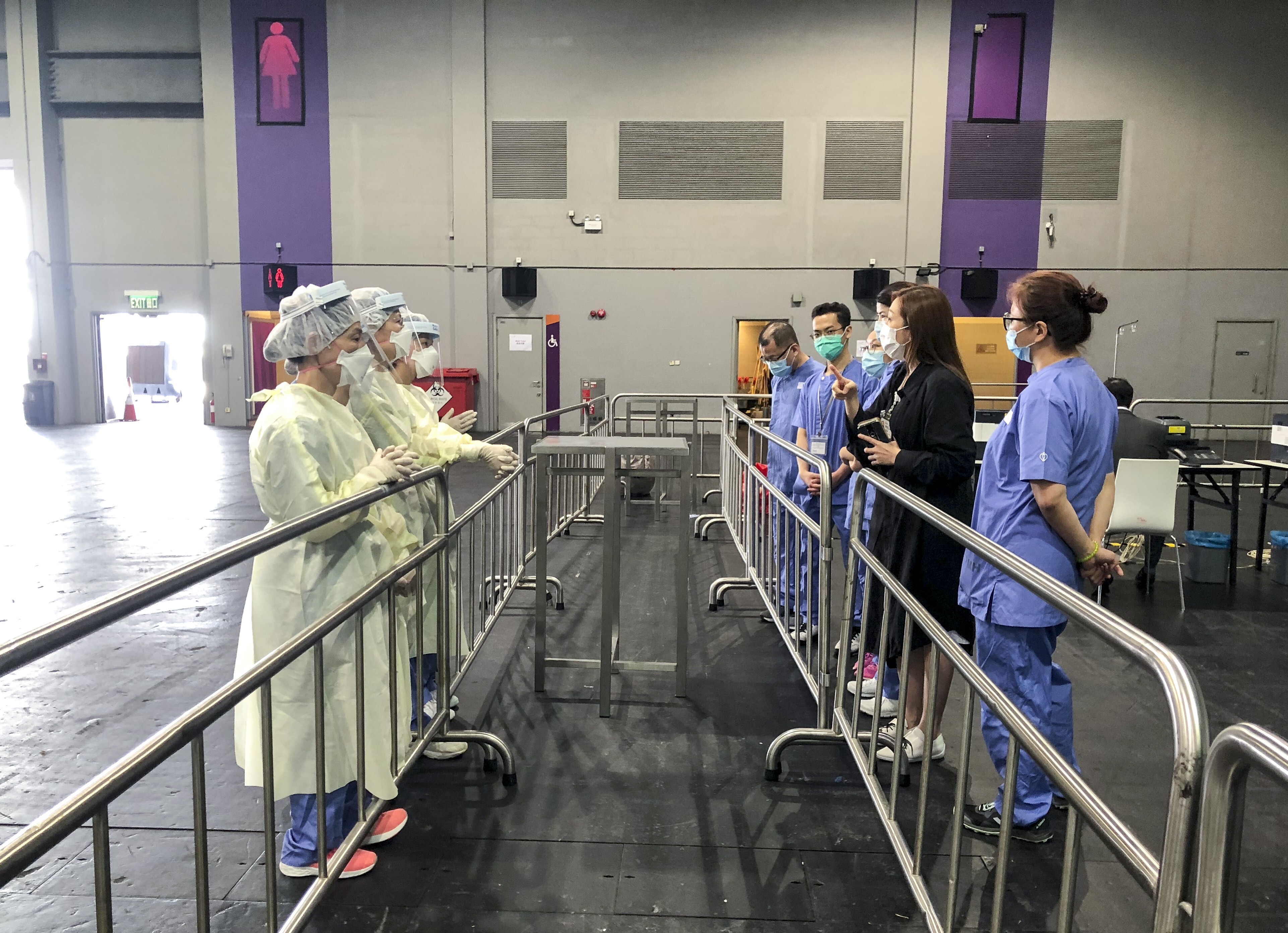 Staff working in different areas at the expo testing facility were separated by barriers. Photo: Handout