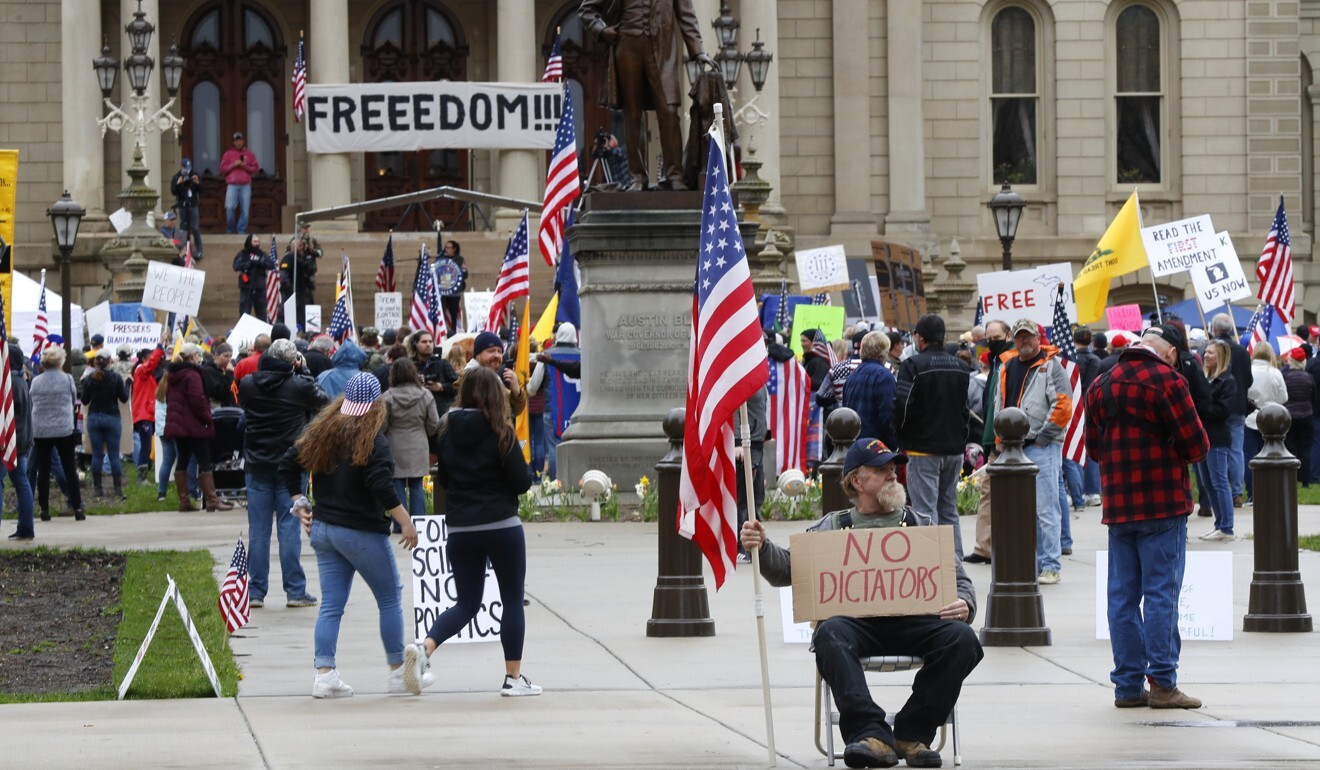 Gun-carrying protesters rally at the State Capitol in Lansing, Michigan on Thursday. Photo: AP