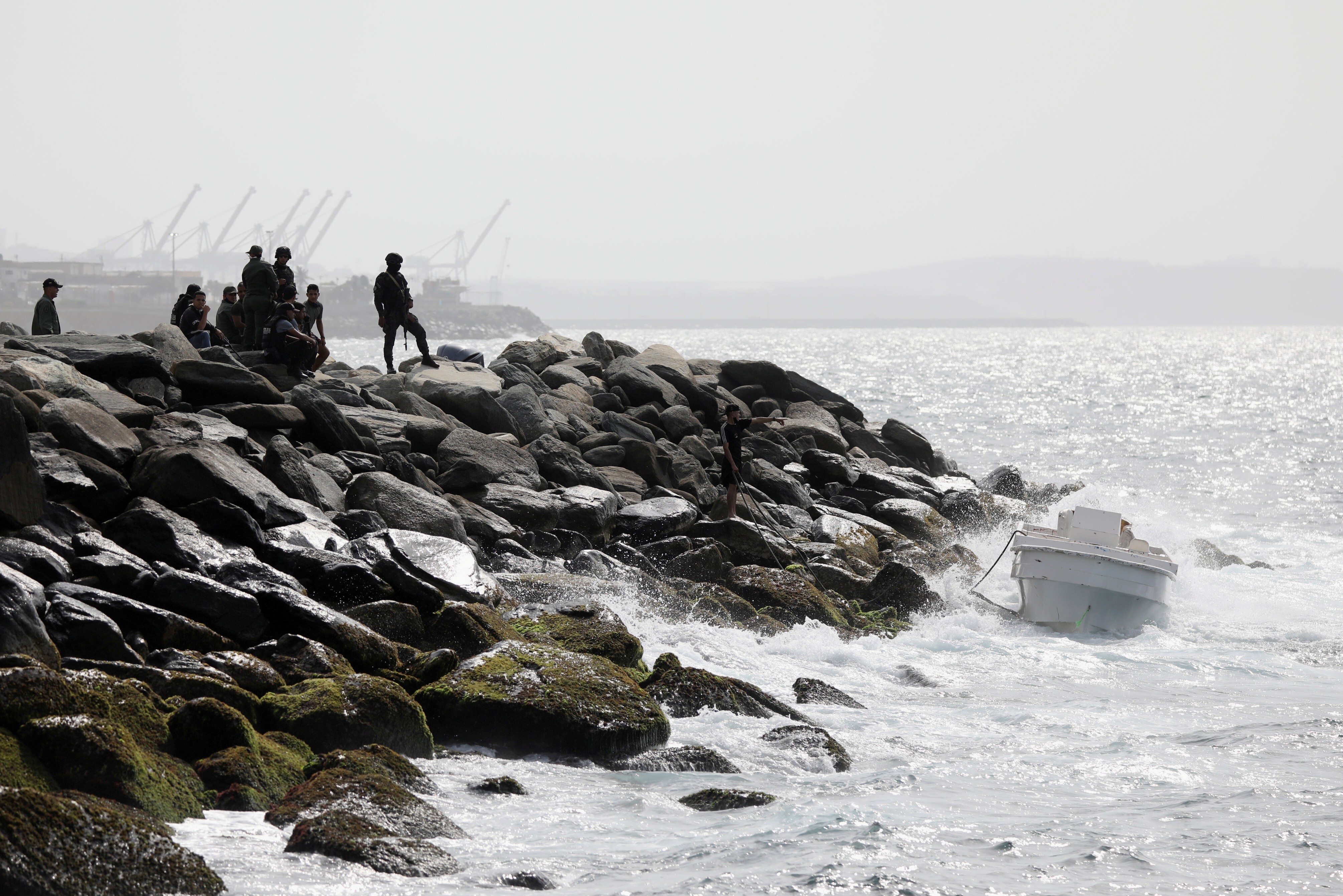 Members of the special forces unit watch an empty boat at a shore, after Venezuela's government announced a failed “mercenary” incursion. Photo: Reuters