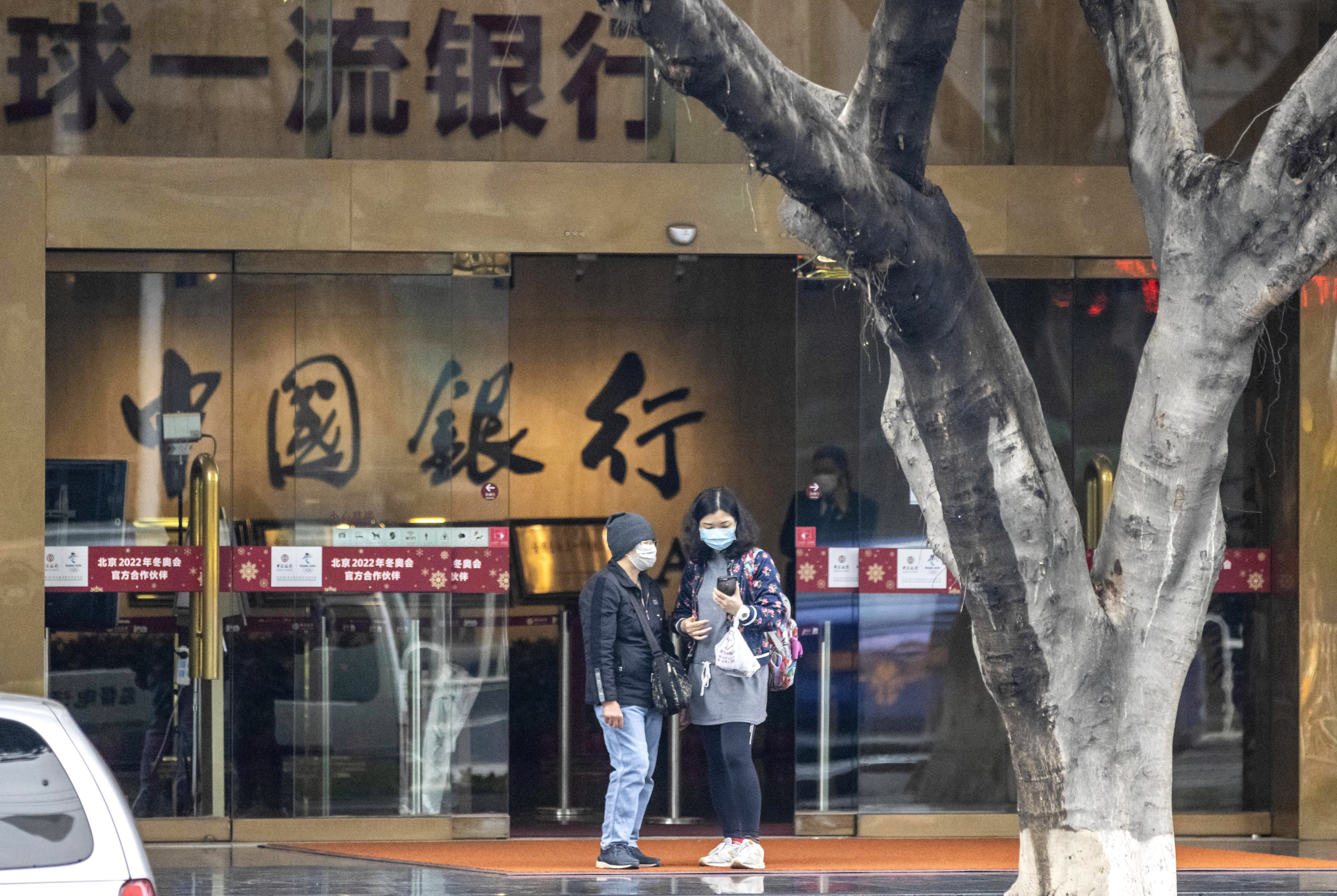 Investors who bought Bank of China’s oil derivatives product gather to protest in front of the bank’s main building in Guangzhou on April 24. Photo: EPA-EFE