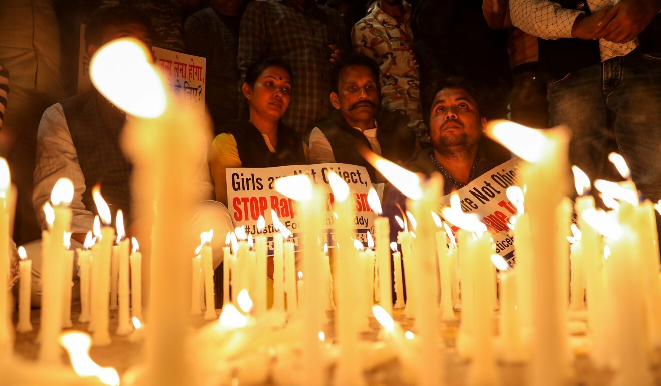 People attend a candle light march in a protest against violence against women. Photo: Reuters