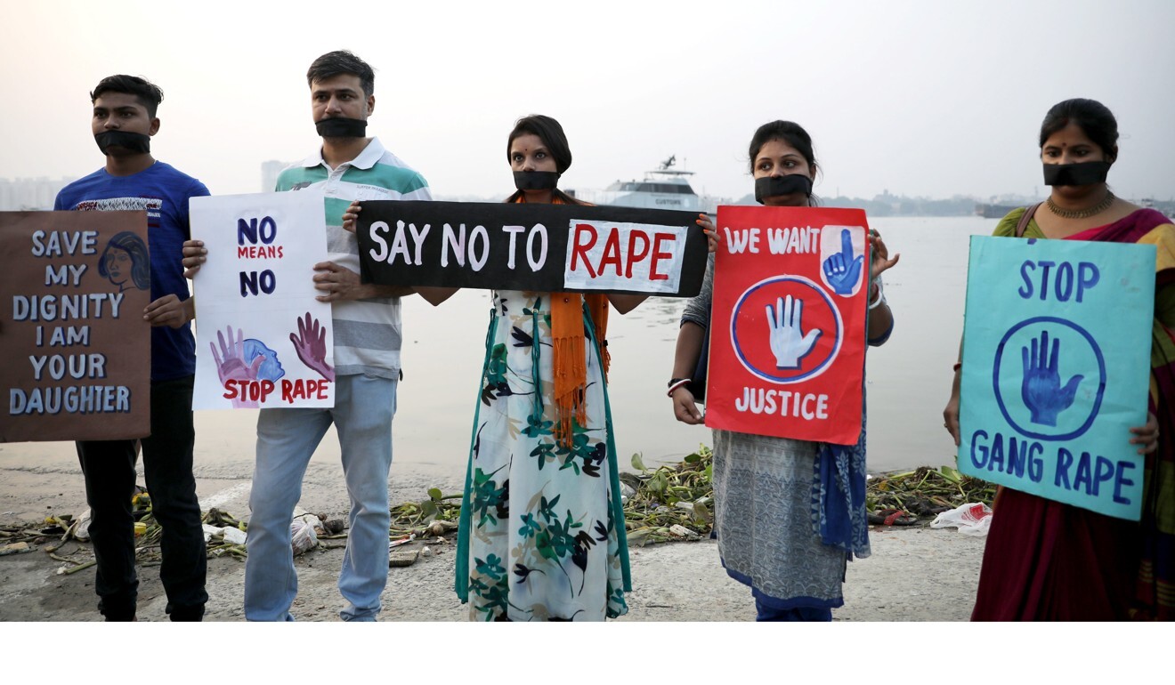 Indian activists stand during a silent protest campaign against rape. Photo: EPA-EFE