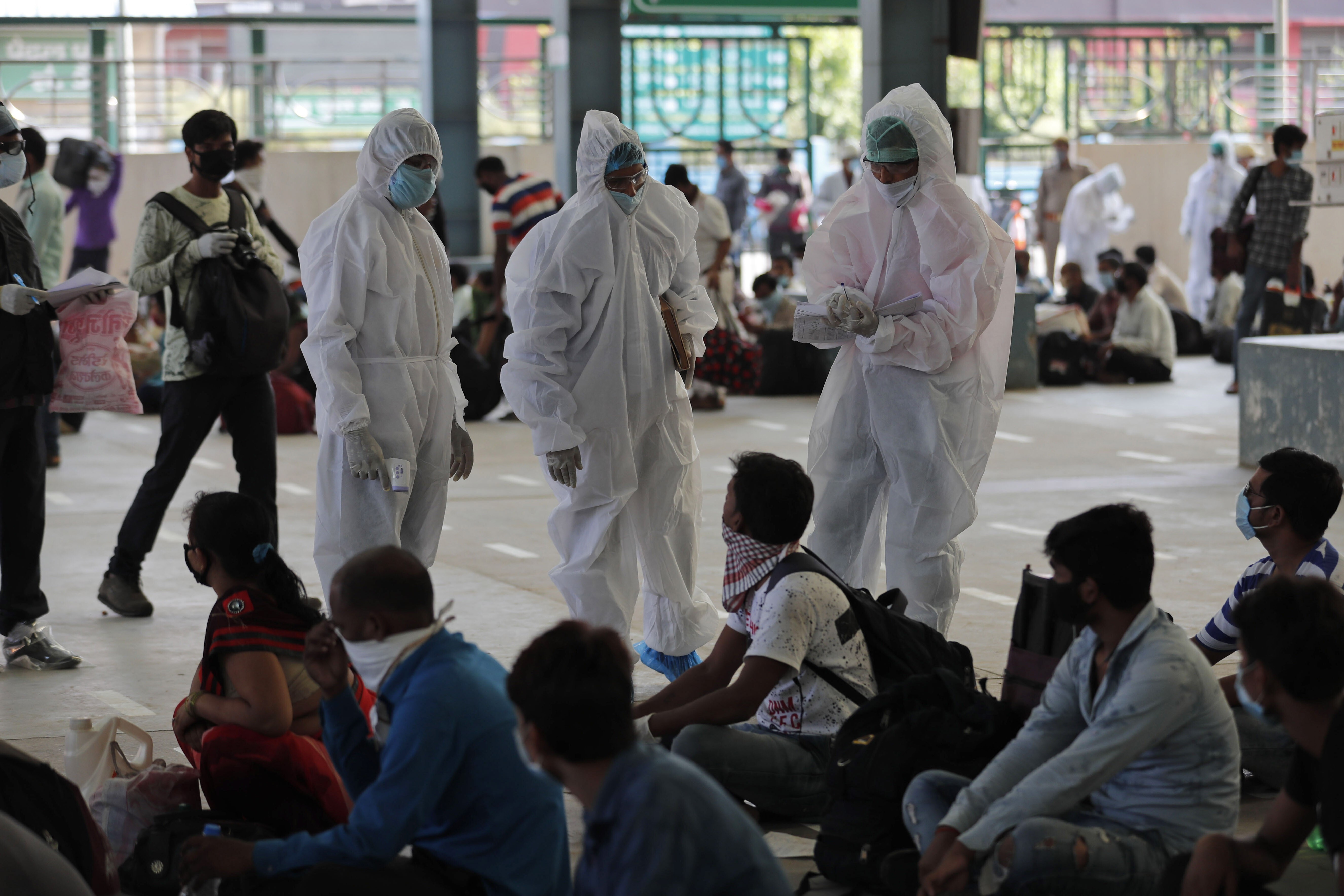 Indian health workers examine migrant labourers on Wednesday. Some 3,600 Hong Kong residents are currently stranded in the country, which is on nationwide lockdown. Photo: AP