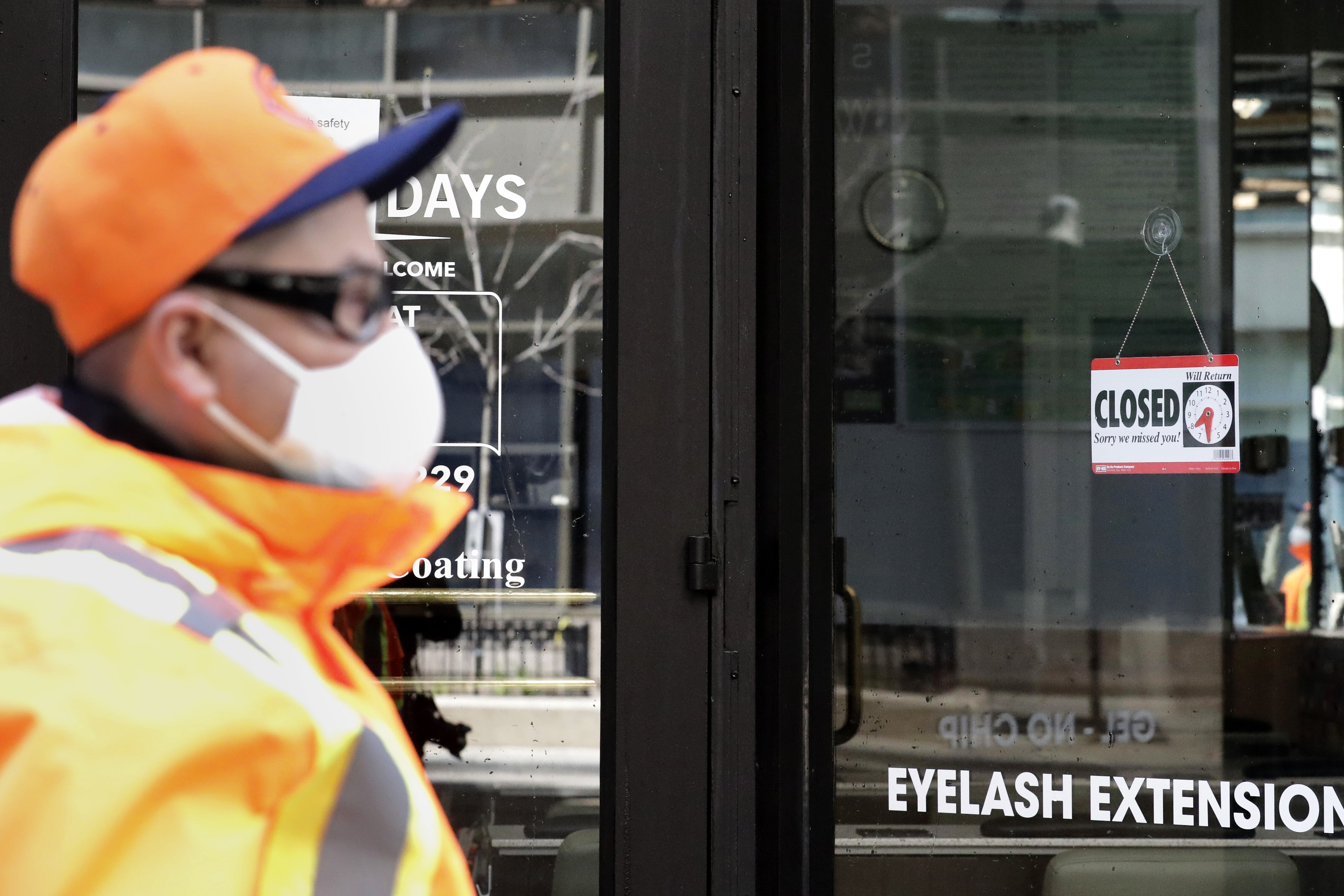 A “closed” sign at a Fashion Nails shop in downtown Chicago. Photo: AP Photo